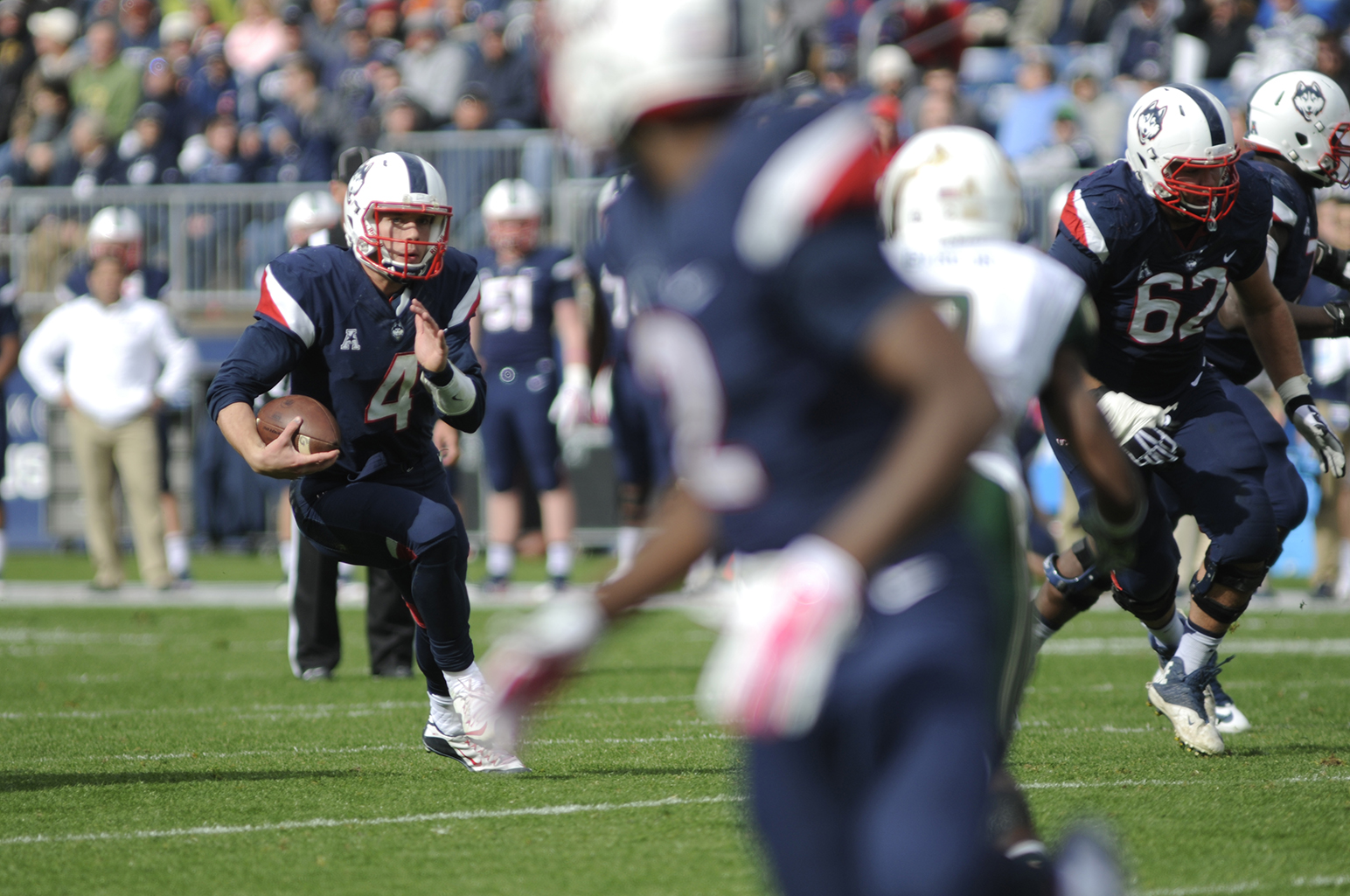 Quarterback Bryant Shirreffs scrambles for yards during UConn's 28-20 loss against USF on Oct. 17, 2015. The Huskies will take on East Carolina on Saturday. (Bailey Wright/The Daily Campus)