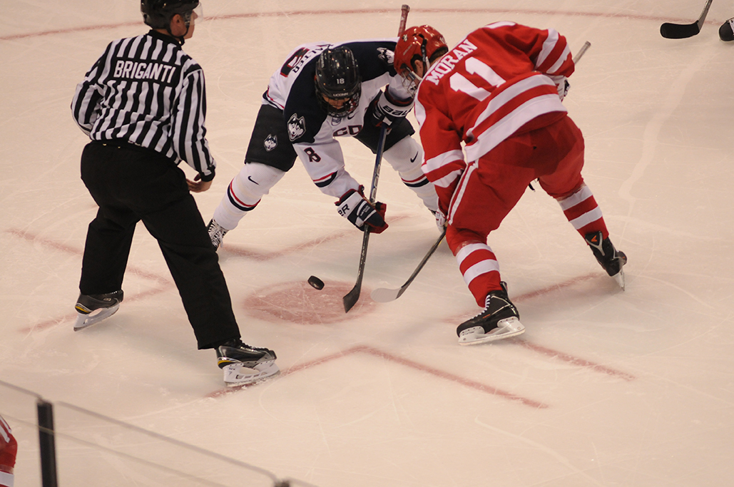 In this file photo, freshman forward Max Kalter takes a faceoff during the Huskies' game against Boston University at XL Center in Hartford, Connecticut on Tuesday, Oct. 27, 2015. (Amar Batra/The Daily Campus)