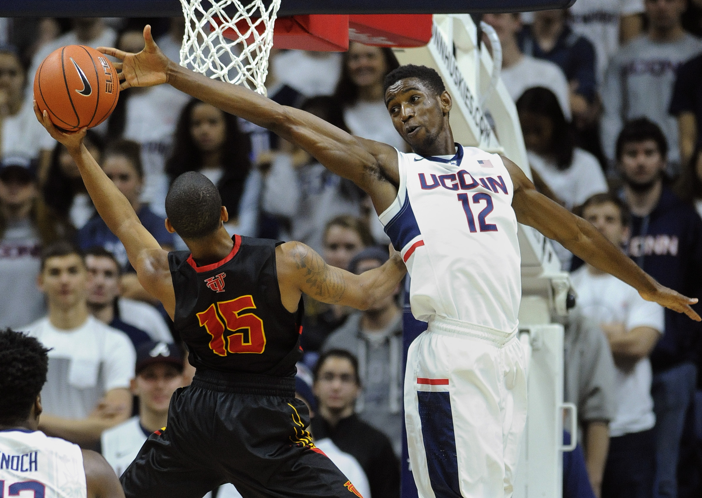 Connecticut's Kentan Facey (12) guards Tampa's Pat Beacon (15) during the second half of an NCAA college basketball game in Storrs, Conn., on Sunday, Nov. 1, 2015. (AP)