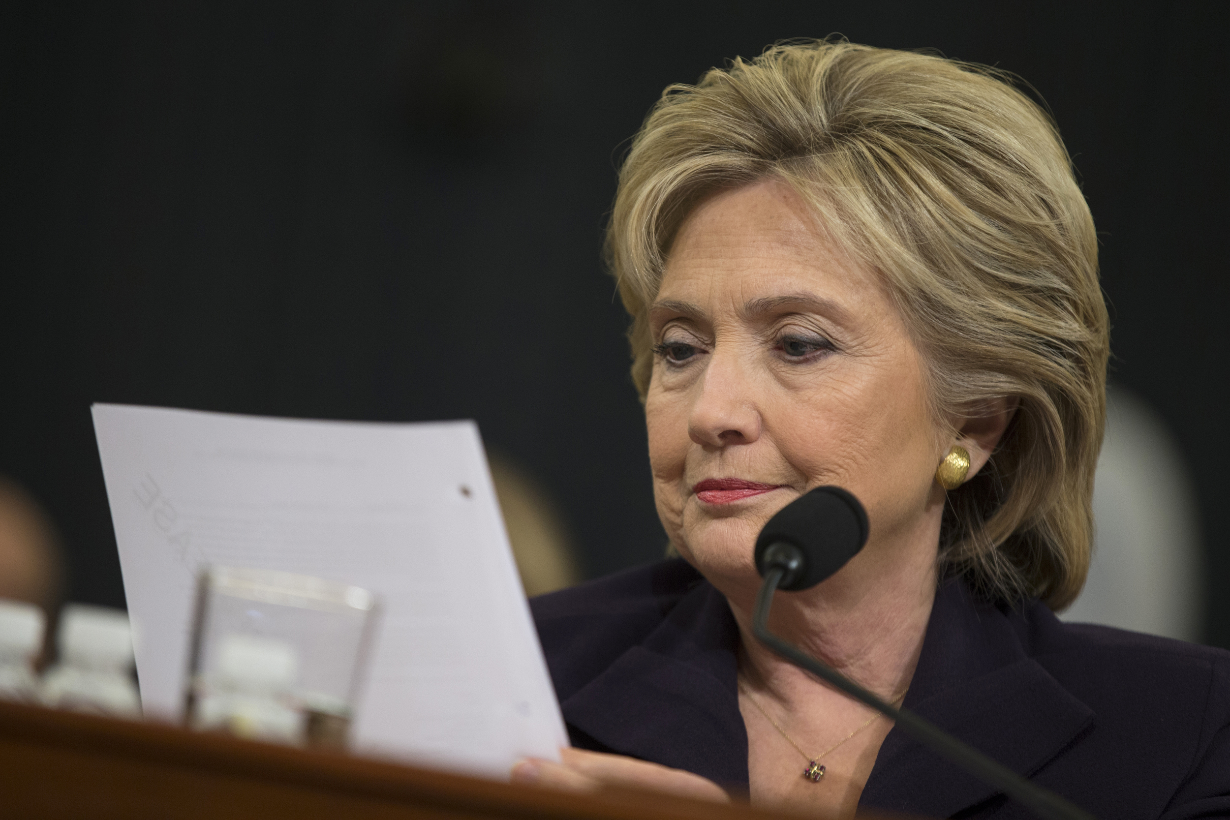 Democratic presidential candidate, former Secretary of State Hillary Rodham Clinton looks at an email sent by Ambassador Chris Stevens during her testimony before the House Benghazi Committee, Thursday, Oct. 22, 2015, on Capitol Hill in Washington. (Evan Vucci/AP)