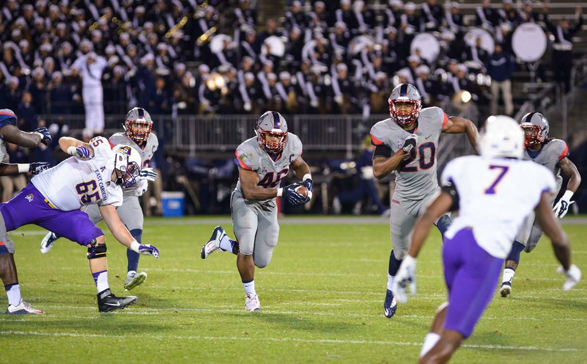 UConn linebacker Marquise Vann returns an interception during the Huskies' game against East Carolina at Pratt & Whitney Stadium at Rentschler Field in East Hartford, Connecticut on Friday, Oct. 30, 2015. The UConn defense is tied for third in the country in total interceptions with 14. (Jason Jiang/The Daily Campus)