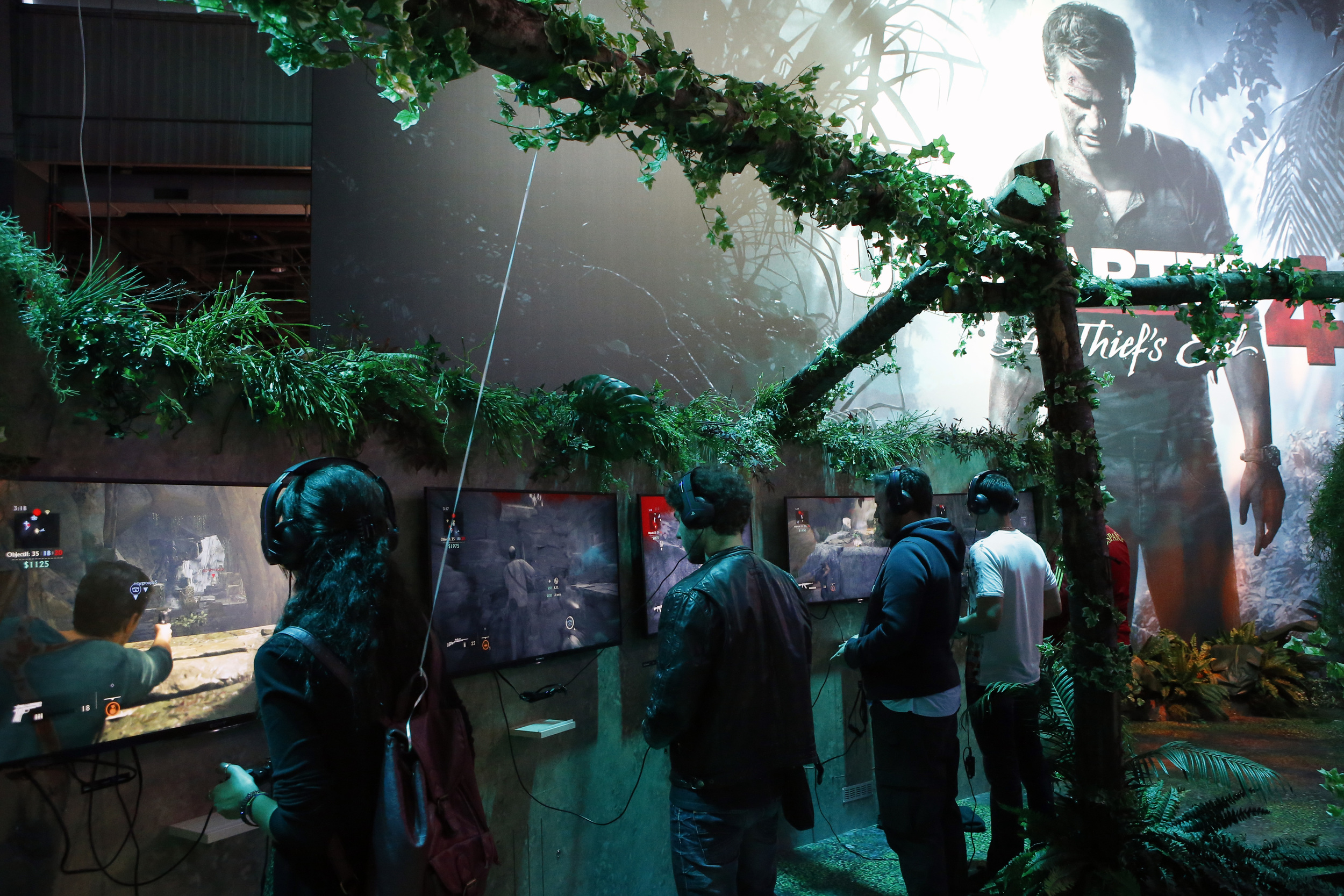 Visitors play with the Playstation at the Paris Games Week, a trade fair for video games in Paris, France. (AP)