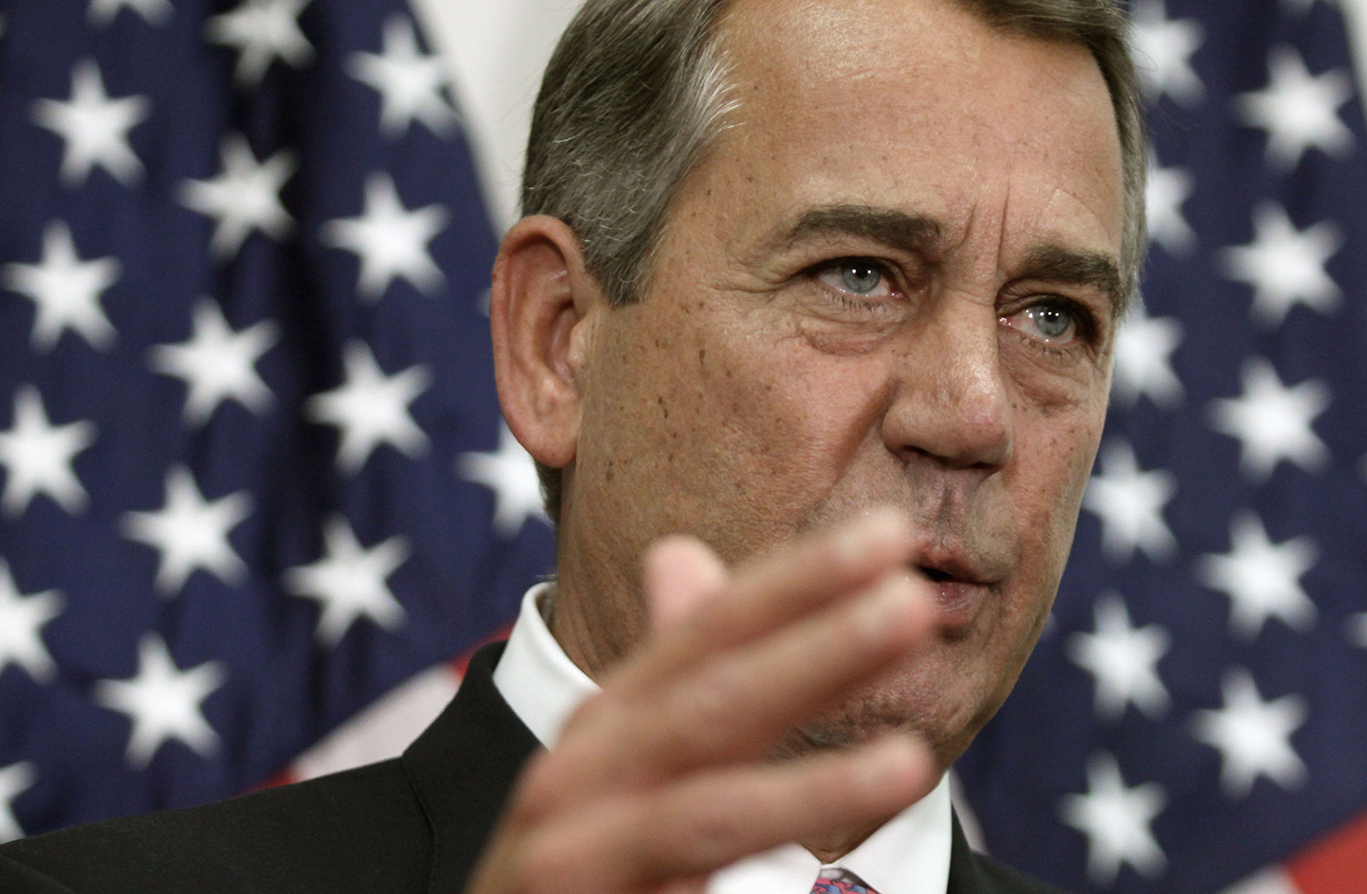Former House Speaker John Boehner talks with reporters on Capitol Hill on Tuesday after he pushed toward a vote on a two-year budget deal despite conservative opposition, relying on the backing of Democrats for the far-reaching pact struck with President Barack Obama. (AP)