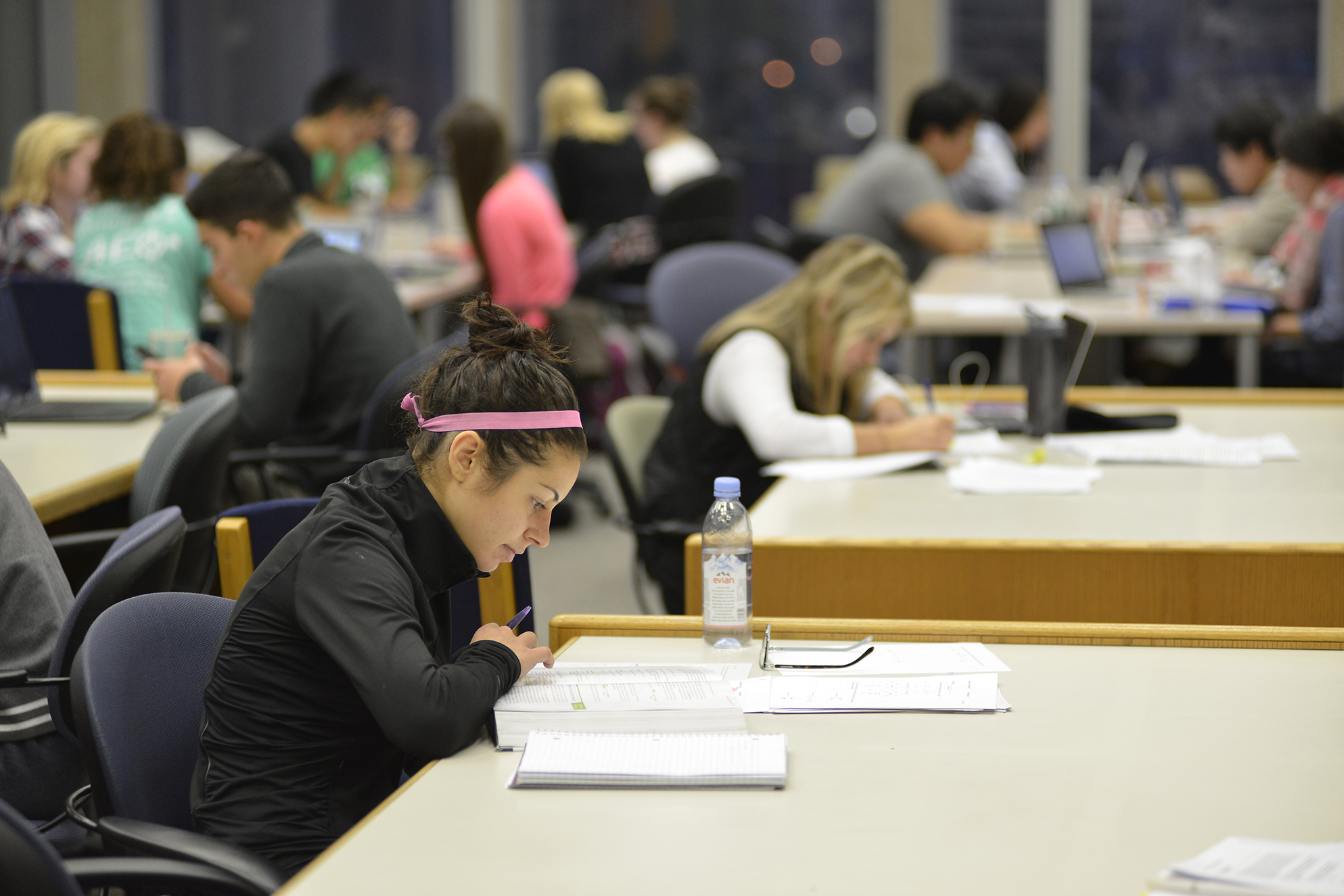 A student studies in the library. Reading days, or days during finals week that don't have exams, are often complained about by students because they're not placed efficiently. (Jason Jiang/Daily Campus)