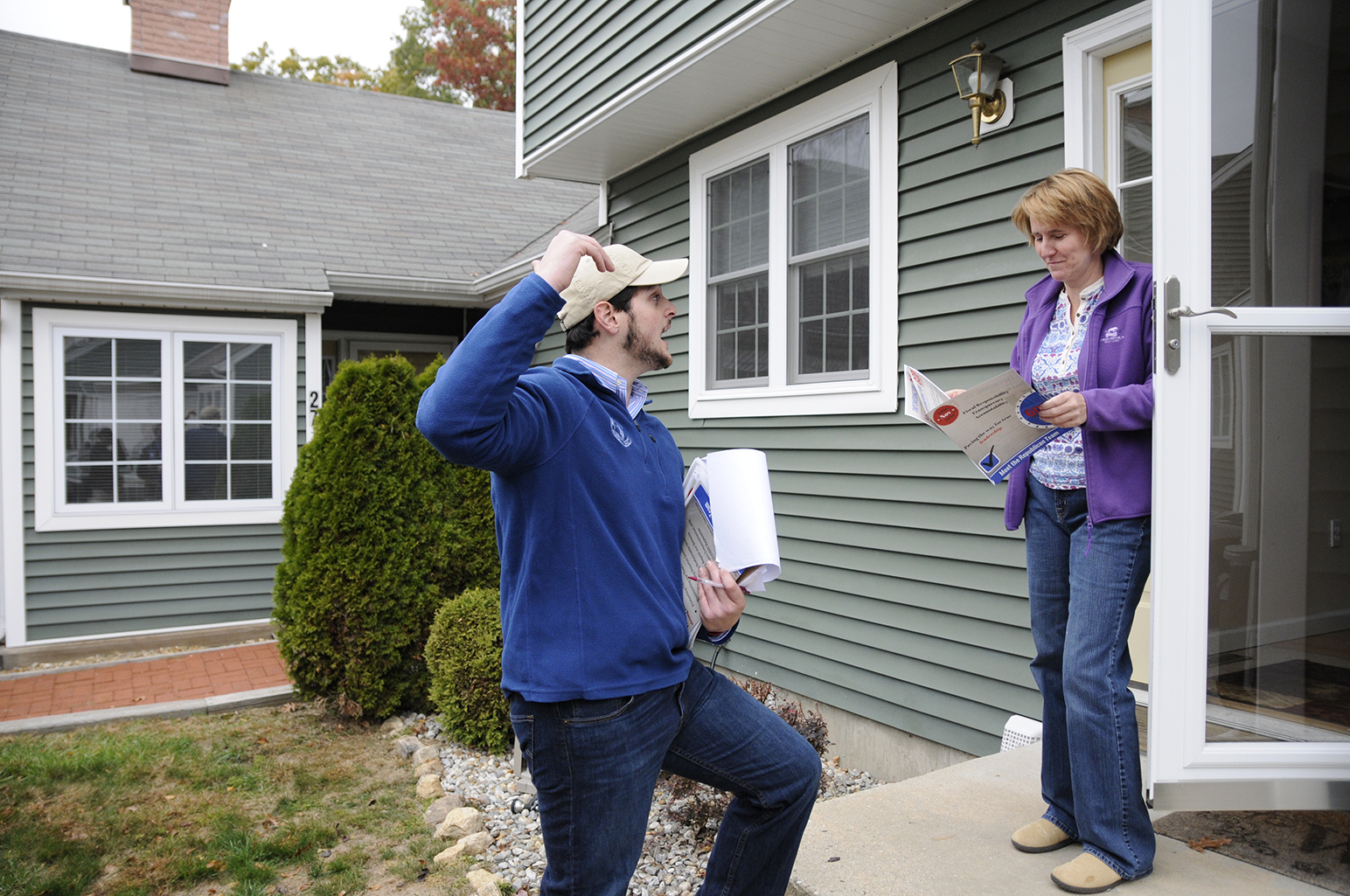 Sargent and other Republicans went door-to-door across Mansfield in order to get their message across to voters. Here Sargent talks with a potential voter in the neighborhood of Freedom Green. (Amar Batra/The Daily Campus)