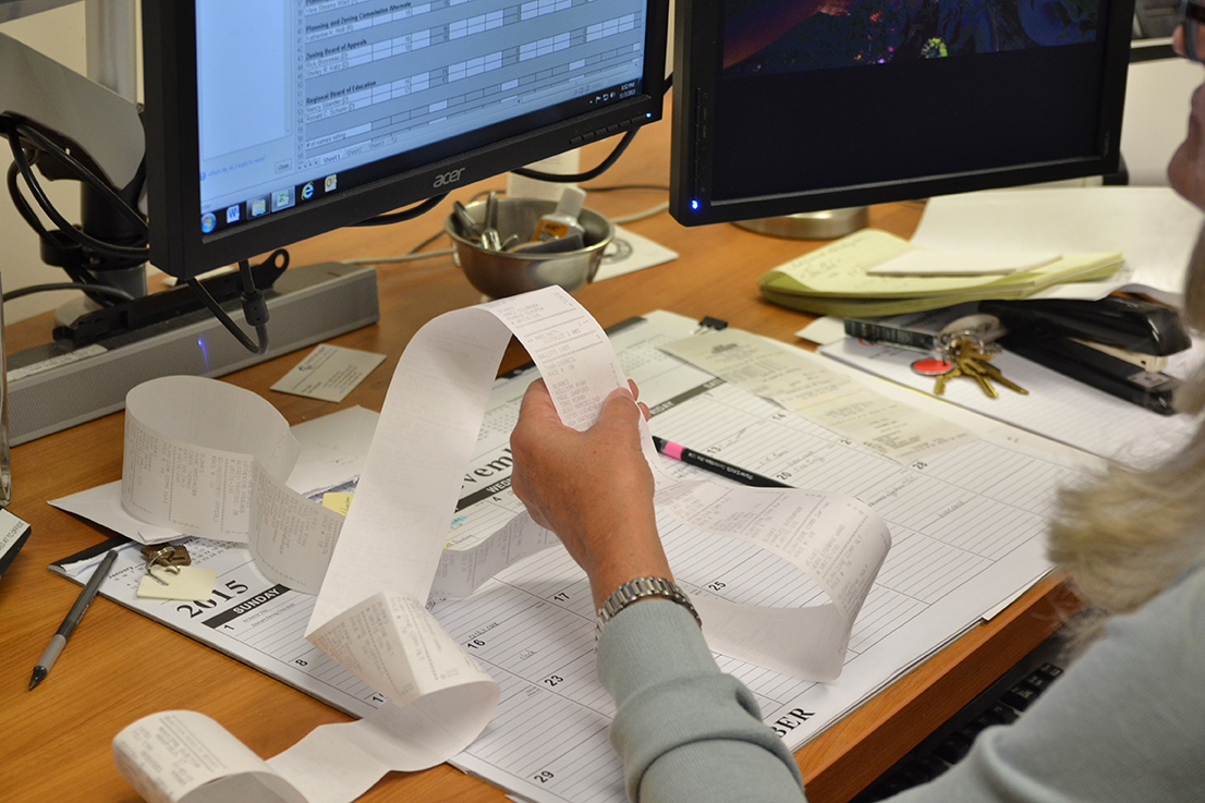 Mansfield Town Clerk Mary Stanton reads out results from various polling stations. Results started to come in at 8:30 p.m., 30 minutes after the polls closed. (Amar Batra/The Daily Campus)
