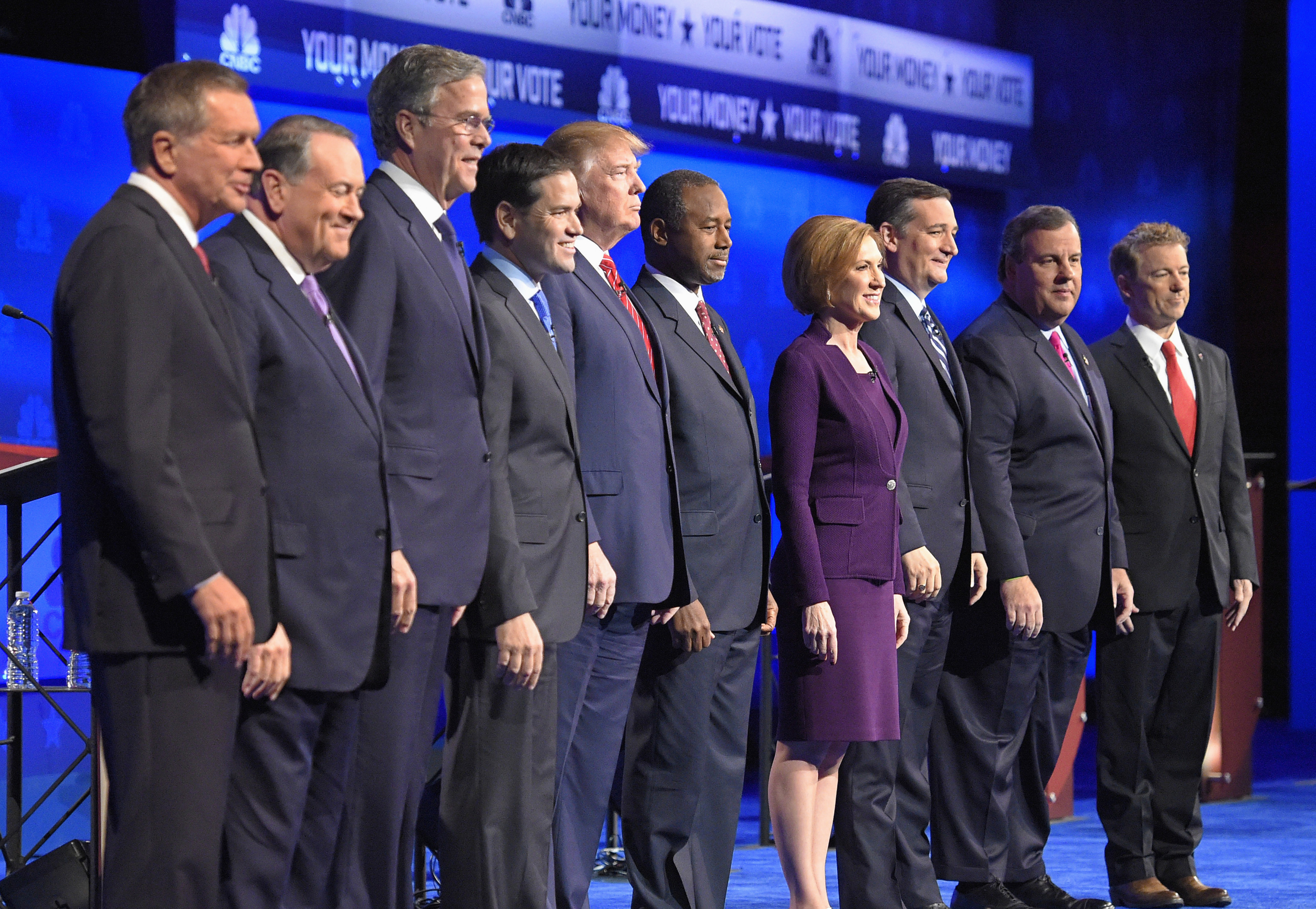 In this photo taken Oct. 28, 2015, Republican presidential candidates, from left, John Kasich, Mike Huckabee, Jeb Bush, Marco Rubio, Donald Trump, Ben Carson, Carly Fiorina, Ted Cruz, Chris Christie, and Rand Paul take the stage during the CNBC Republican presidential debate at the University of Colorado, in Boulder, Colo. (Mark J. Terrill/AP)