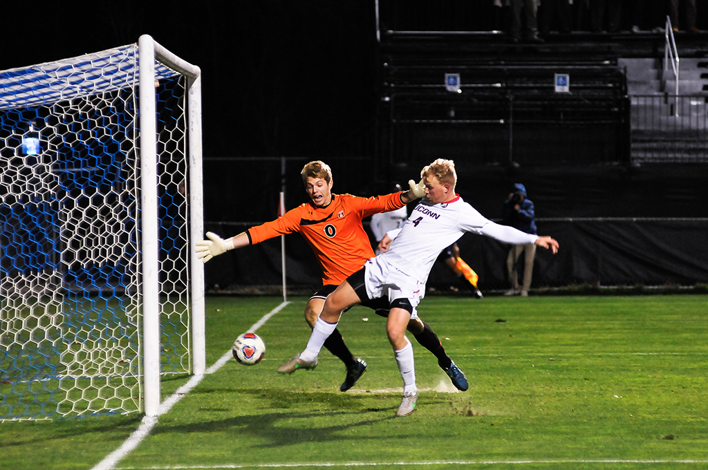 UConn men's soccer defender Simen Olafsen kicks the ball into the net after a set piece during the Huskies' game against Temple during the American Athletic Conference tournament quarterfinal at Joseph J. Morrone Stadium in Storrs, Connecticut on Saturday, Nov. 7, 2015. (Jason Jiang/The Daily Campus)
