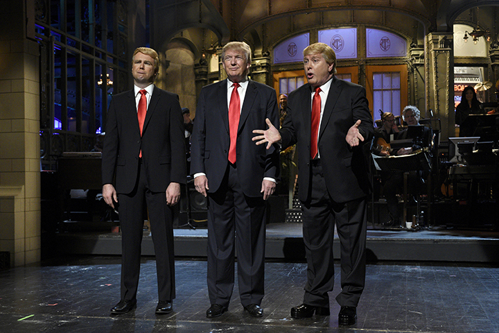 Taran Killam, left, Republican presidential candidate and guest host Donald Trump , center, and Darrell Hammond perform during the monologue on "Saturday Night Live", Saturday, Nov. 7, 2015. Trump's 90 minutes in the " SNL " spotlight followed weeks of growing anticipation, increasingly sharp criticism and mounting calls for him to be dropped from the show. (AP).
