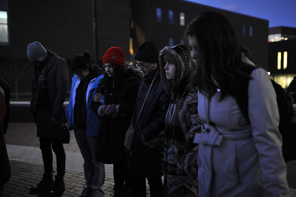 Students are seen at a prayer vigil sponsored by Cru at UConn, an interdenominational Christian organization, on Fairfield Way in Storrs, Connecticut on Saturday, Nov. 14, 2015. Around 20 students attended the vigil. (Jason Jiang/The Daily Campus)