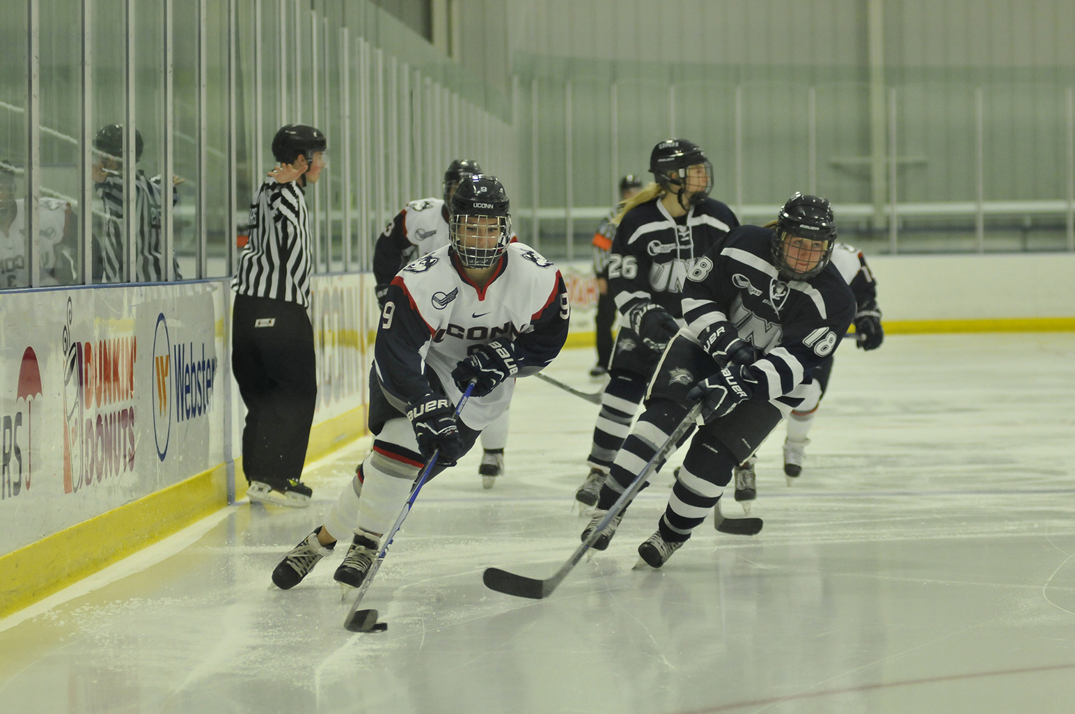 UConn junior defender Jessica Stott handles the puck during the Huskies' game against New Hampshire at the Freitas Ice Forum in Storrs, Connecticut on Sunday, Nov. 8, 2015.