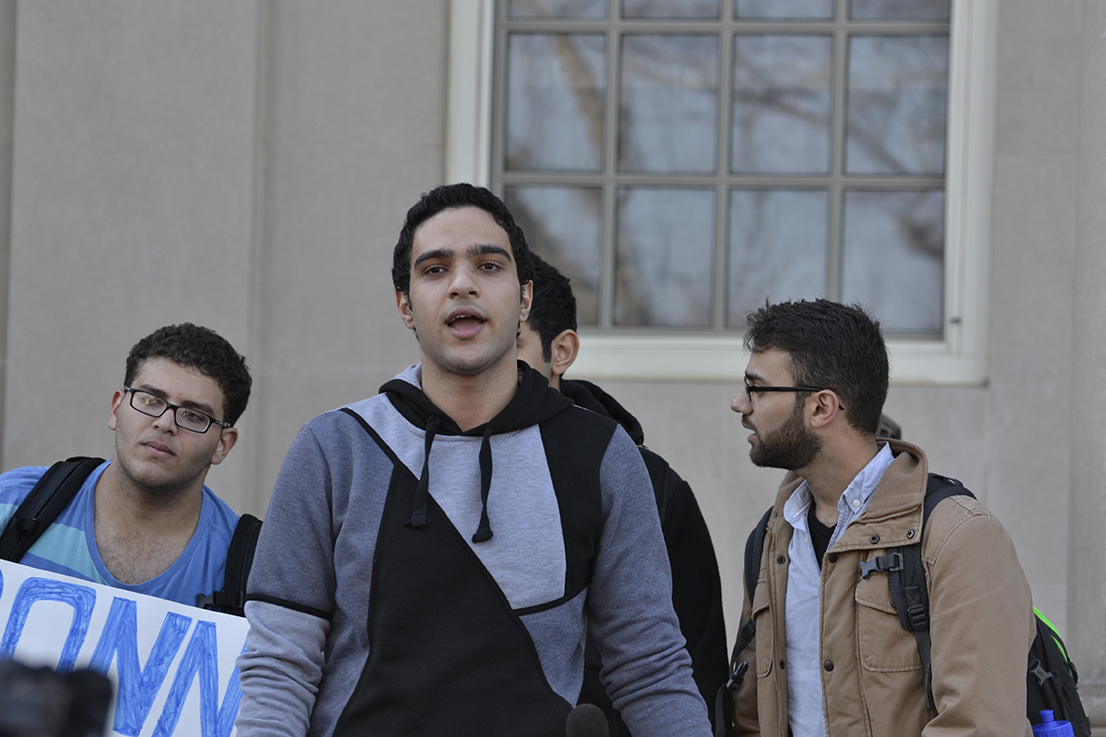 UConn student Mahmoud Hashem (center) speaks on the back steps of the Wilbur Cross building during a demonstration against discrimination and intolerance on Monday, Nov. 16, 2015. (Rebecca Newman/The Daily Campus)