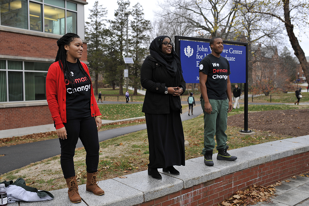 Event organizers (left to right) Charity Whitehead, Haddiyyah Ali and Justin Rose address the crowd during the Speak Out on Fairfield Way in Storrs, Connecticut on Thursday, Nov. 19, 2015. (Jason Jiang/The Daily Campus)