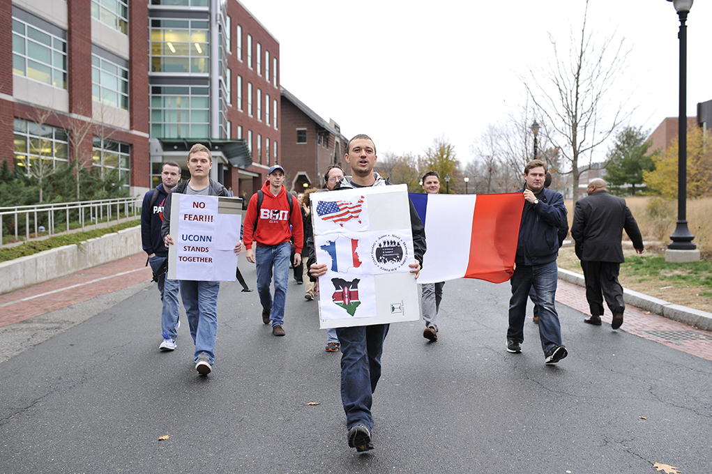 UConn student Samuel Surowitz (middle) leads the UConn Veteran Student Organization march “No Fear: A March in Solidarity With Victims & Against Terrorism," down Fairfield Way in Storrs, Connecticut on Thursday, Nov. 19, 2015. (Jason Jiang/The Daily Campus)