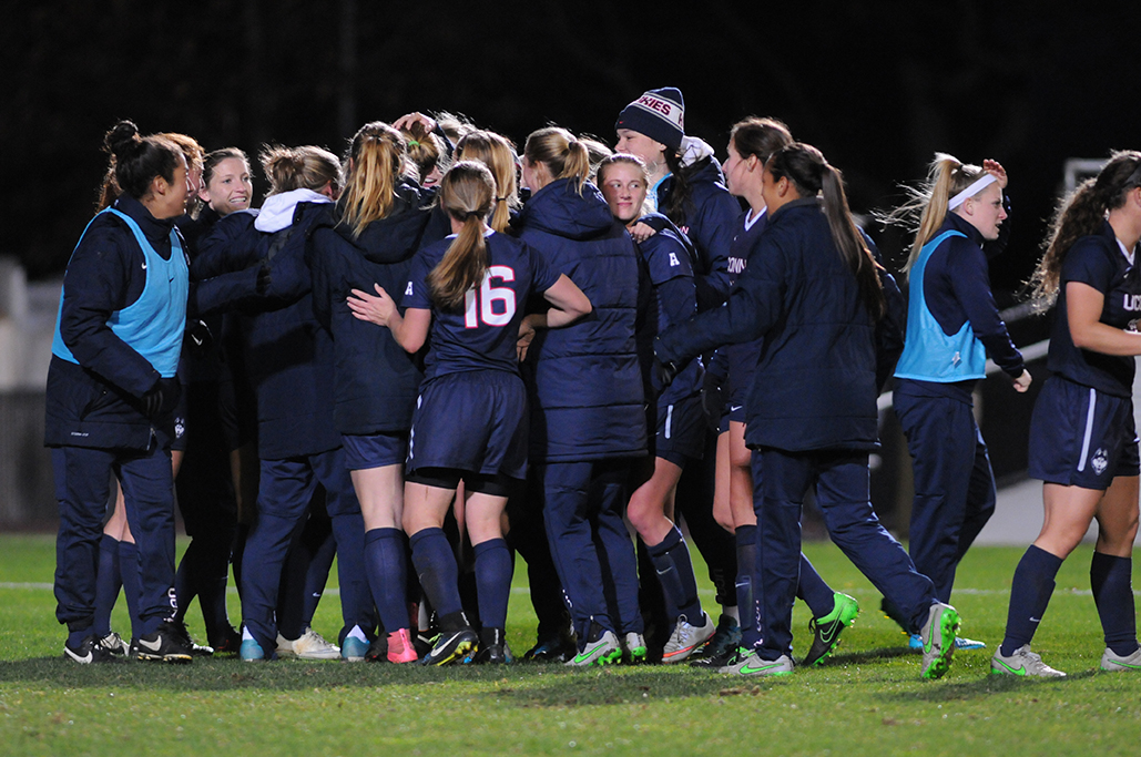 The UConn women's soccer team celebrates after upsetting No. 10 Notre Dame 2-0 in Piscataway, New Jersey on Friday, Nov. 20, 2015. Junior forward Rachel Hill scored both goals. (Amar Batra/The Daily Campus)
