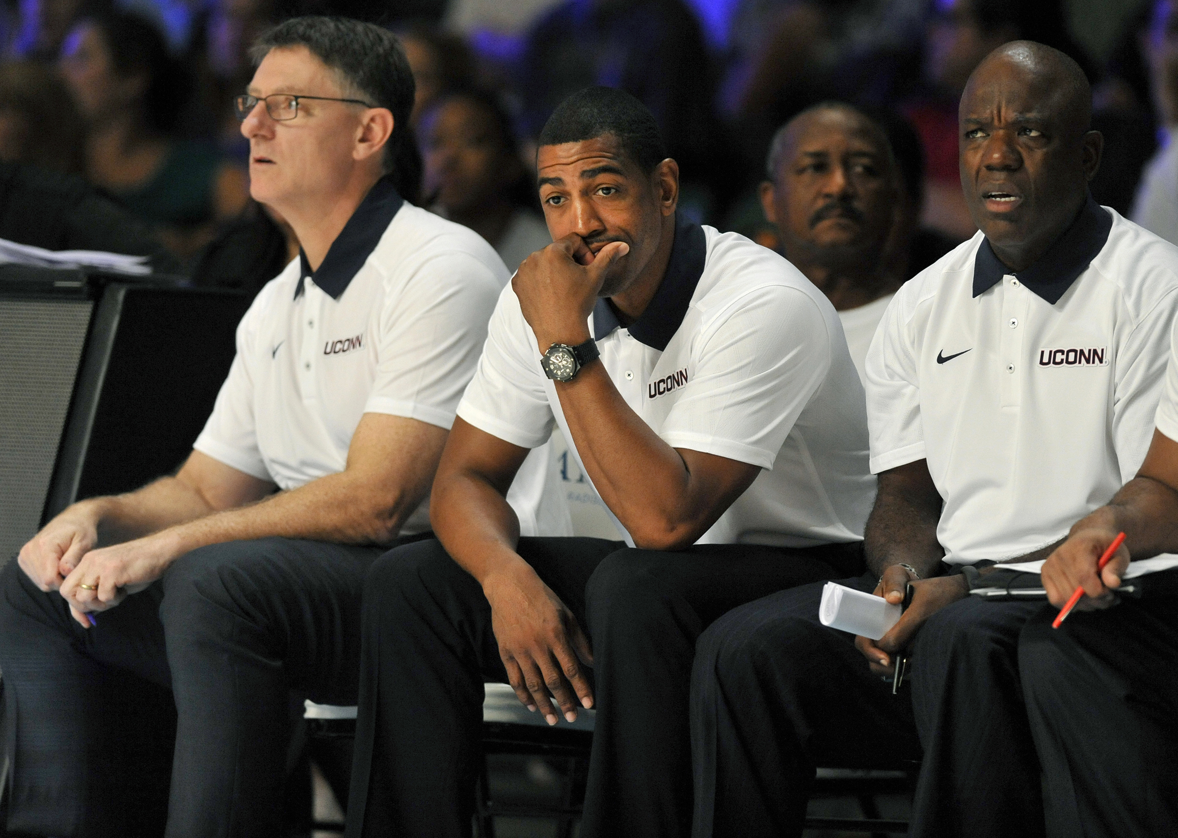 Connecticut head coach Kevin Ollie, center, looks on as his team plays Gonzaga during the second half of an NCAA college basketball game, Friday, Nov. 27, 2015 in Paradise Island, Bahamas. (Brad Horrigan/Hartford Courant via AP)