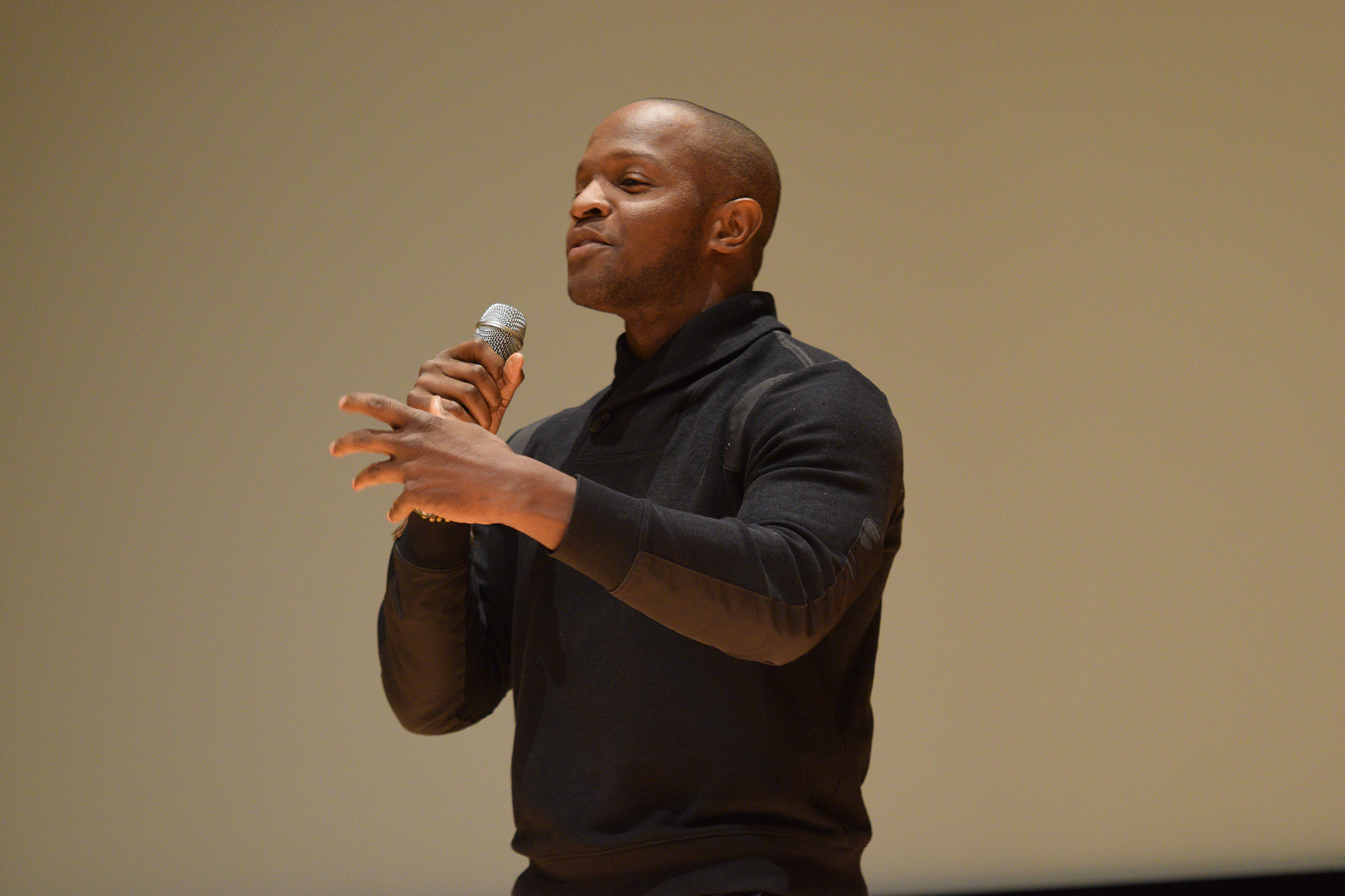 Qasim Basir, writer and director of the 2010 film "Mooz-Lum," answers audience questions after a screening of the film in the UConn Student Union Theater in Storrs, Connecticut on Monday, Nov. 30, 2015. (Grant Zitomer/The Daily Campus)
