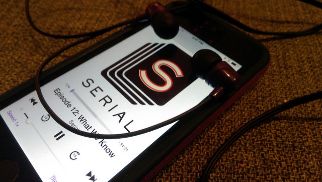 An iPhone with headphones playing the last episode of the Serial NPR podcast. (Casey Fiesler/Flickr)