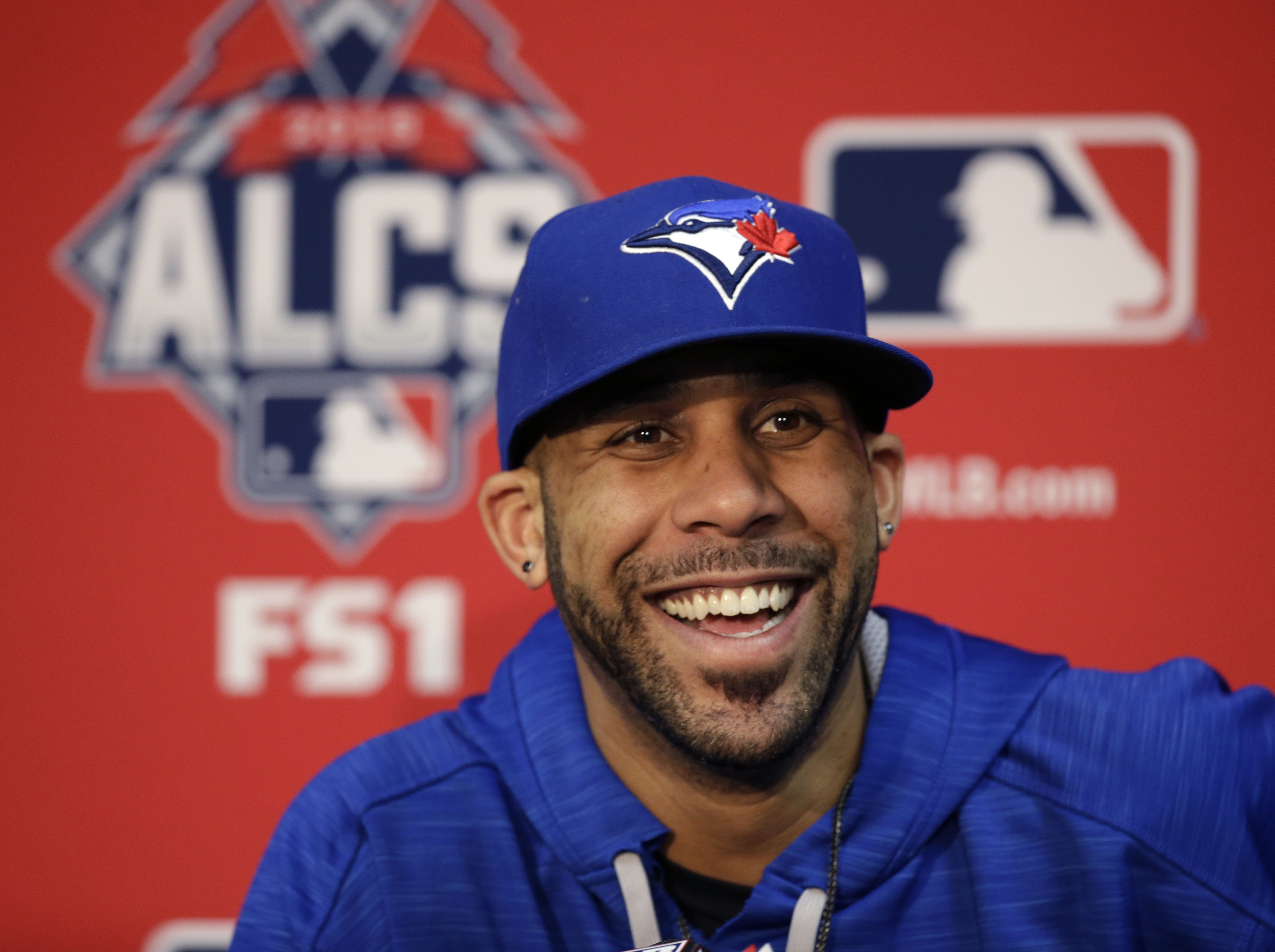 In this Oct. 22, 2015, file photo, Toronto Blue Jays starting pitcher David Price smiles during a news conference at Kauffman Stadium in Kansas City, Mo. The Boston Red Sox and AL Cy Young runner-up David Price have agreed to terms on a seven-year free-agent deal worth $217 million, a person familiar with the negotiations told The Associated Press. (AP Photo/Orlin Wagner, File)