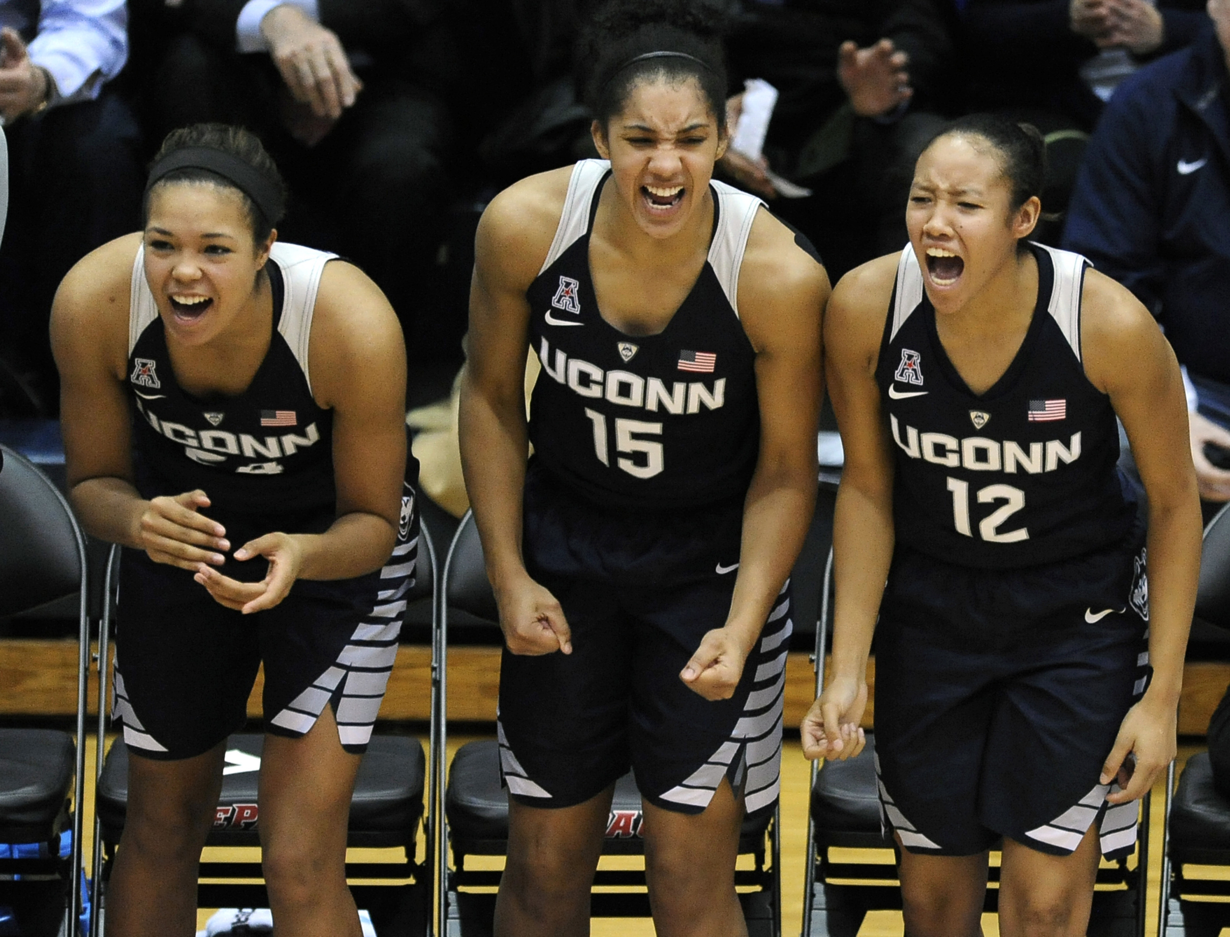 Connecticut's Saniya Chong (12), Gabby Williams (15), and Napheesa Coller (24), celebrate during the final seconds of a basketball game against DePaul, Wednesday, Dec. 2, 2015, in Chicago. Connecticut won 86-70. (Paul Beaty/AP)