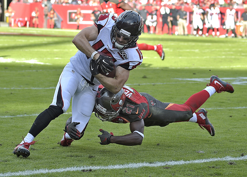 Atlanta Falcons wide receiver Nick Williams eludes Tampa Bay Buccaneers cornerback Alterraun Verner (21) as he scores on a 5-yard touchdown reception during the fourth quarter of an NFL football game Sunday, Dec. 6, 2015, in Tampa, Fla. (AP Photo/Phelan M. Ebenhack)