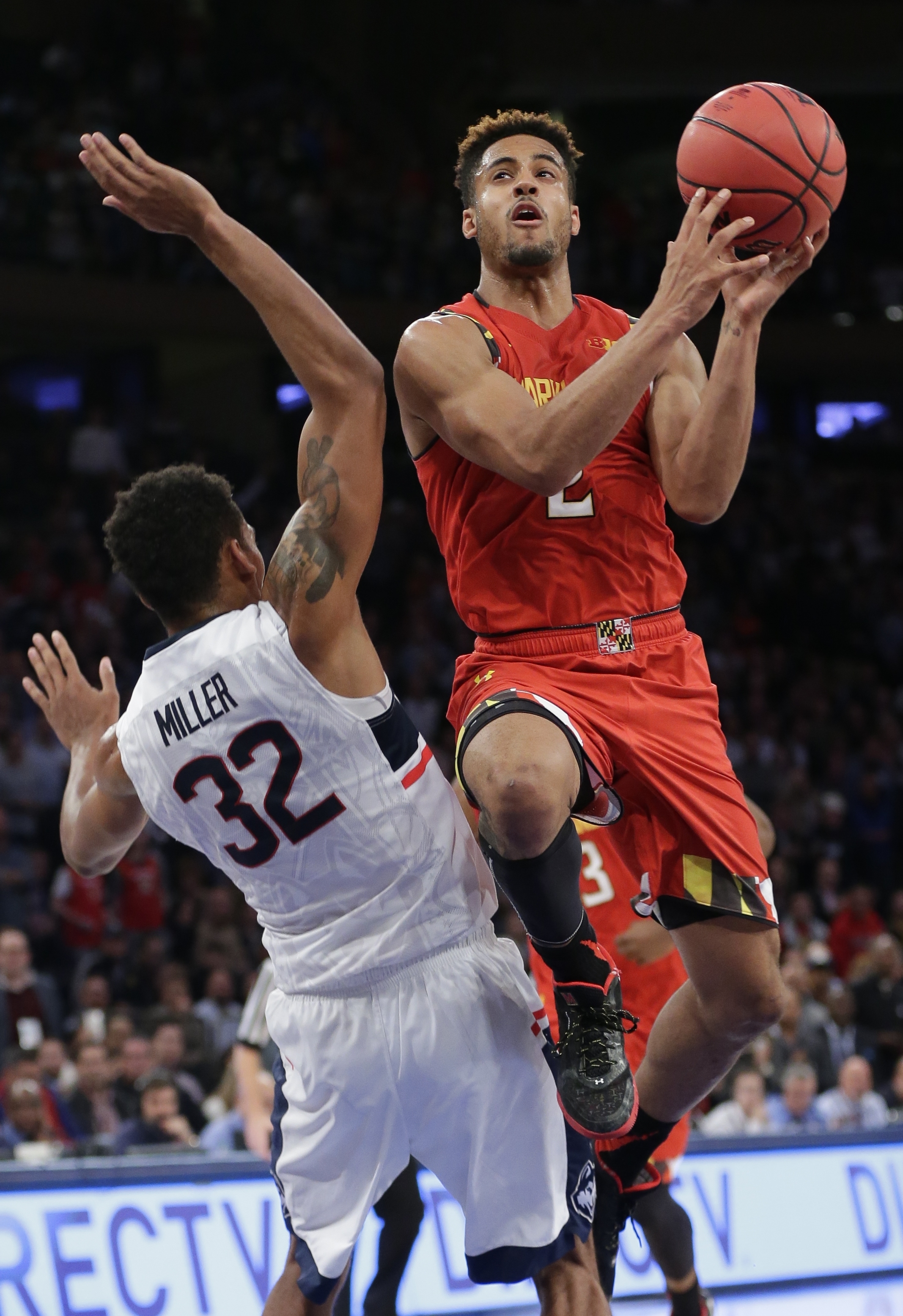 Maryland's Melo Trimble (2) drives past Connecticut's Shonn Miller (32) during the second half of an NCAA college basketball game, Tuesday, Dec. 8, 2015, in New York. Maryland won 76-66. (AP Photo/Frank Franklin II)