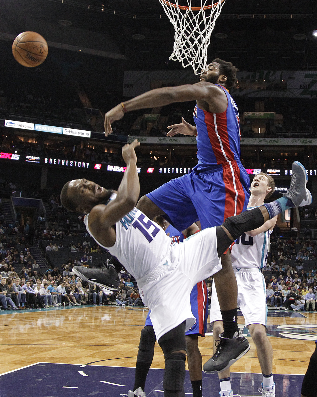 Detroit Pistons' Andre Drummond (0) blocks a shot by Charlotte Hornets' Kemba Walker (15) in the second half of an NBA basketball game in Charlotte, N.C., Monday, Dec. 7, 2015. (AP Photo/Chuck Burton)