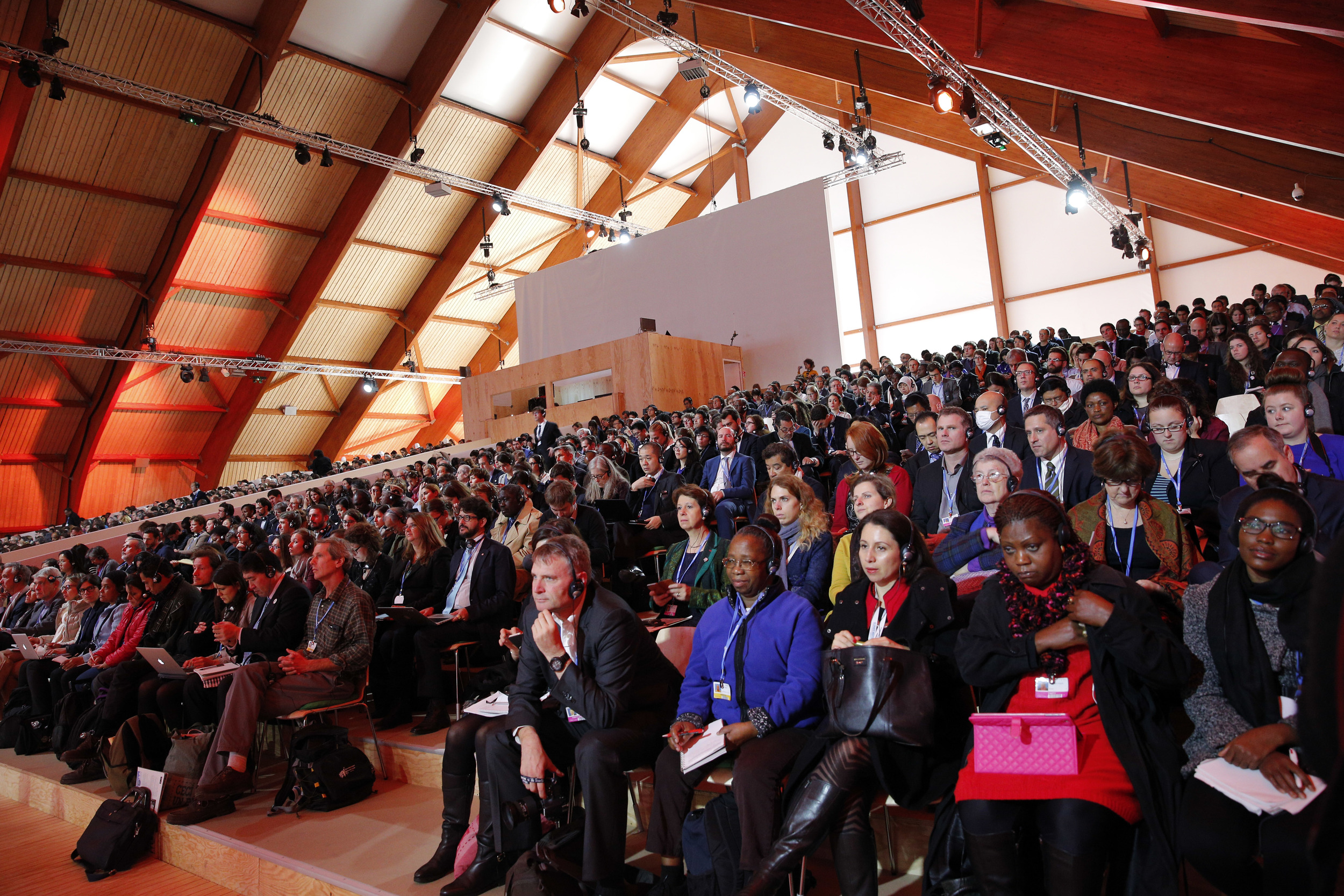Participants attend a conference at the COP21, United Nations Climate Change Conference in Le Bourget, north of Paris, France, Thursday, Dec. 10, 2015. (Christophe Ena/AP)