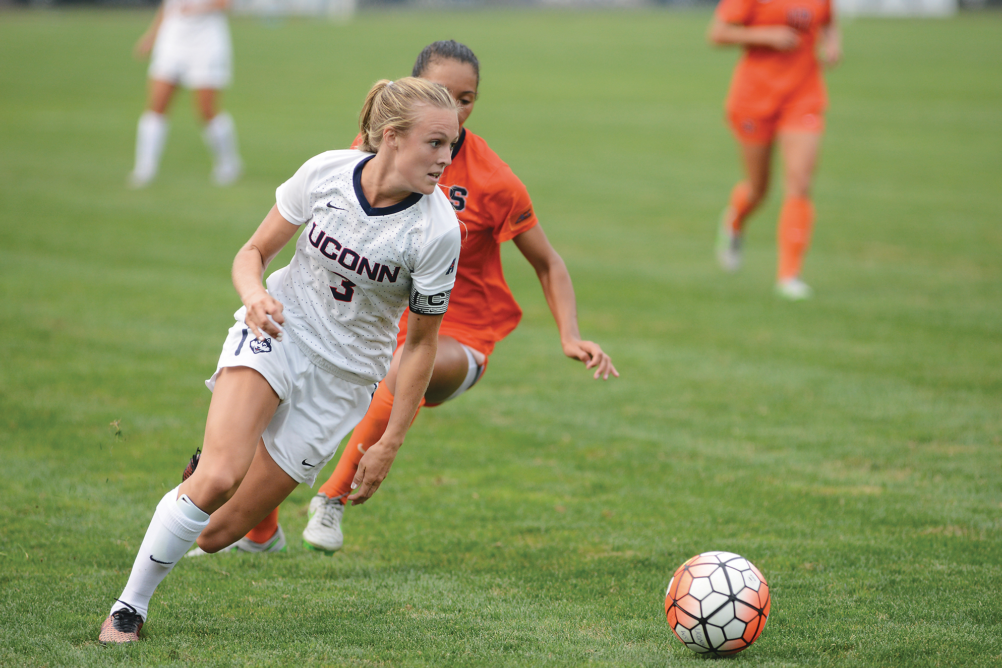 UConn junior forward Rachel Hill away from a Syracuse defender during the Huskies' game at Joseph J. Morrone Stadium in Storrs, Connecticut on Sept. 3. 2015. (Jason Jiang/The Daily Campus)