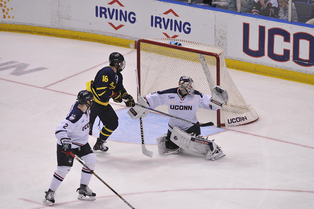 UConn men's ice hockey goaltender Rob Nichols looks for the puck during the Huskies' game against Merrimack at XL Center in Hartford, Connecticut on Friday, Dec. 11, 2015. (Jason Jiang/The Daily Campus)