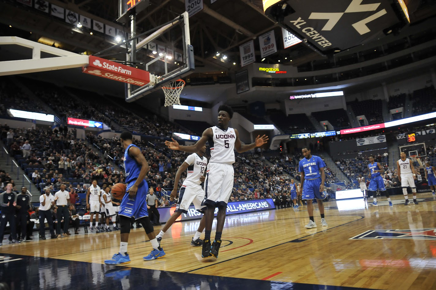 Daniel Hamilton (#5) celebrates after completing his triple-double during UConn's 99-52 win over CCSU. He is the 10th player in UConn history to achieve the milestone. (Ashley Maher/The Daily Campus)
