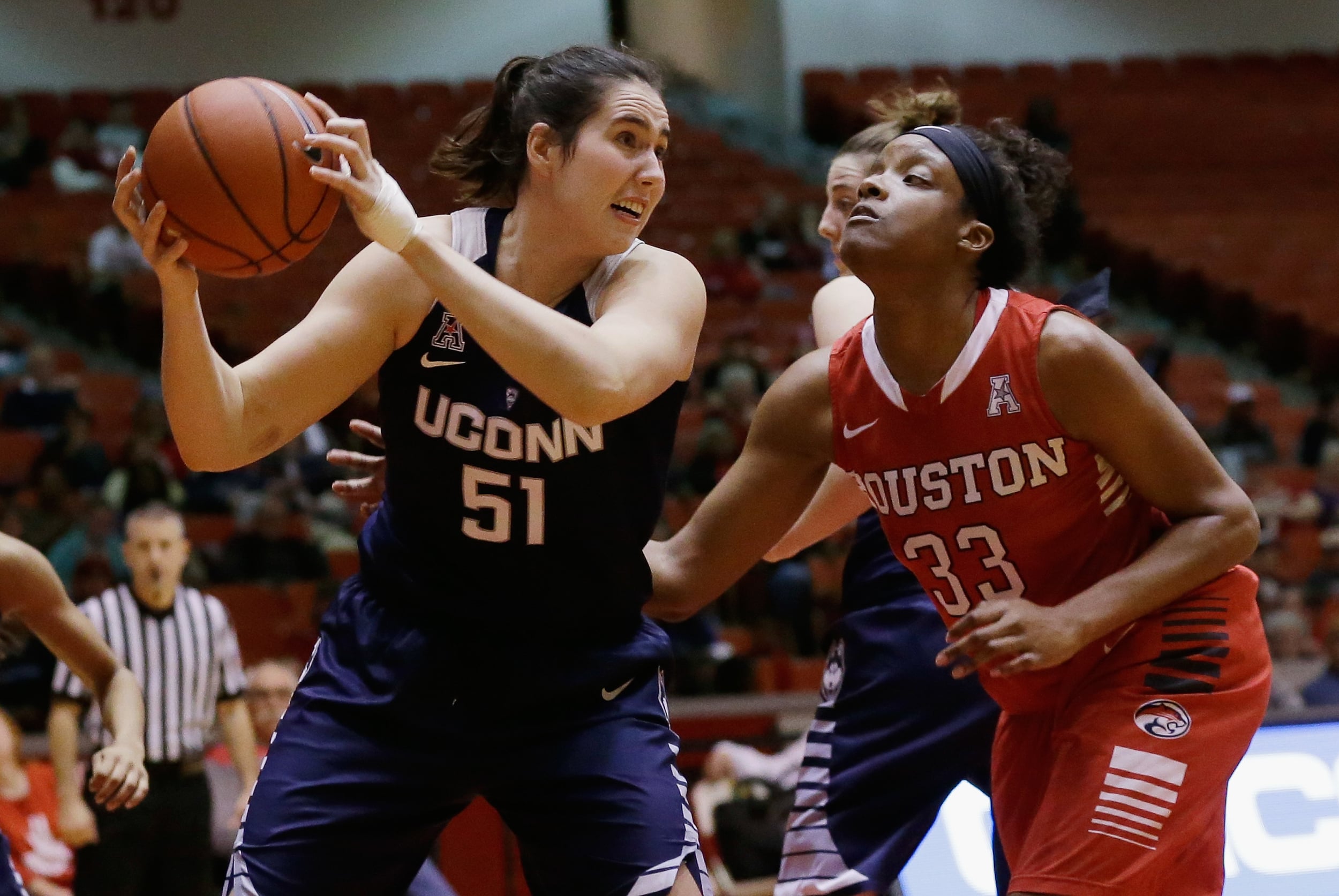 Connecticut center Natalie Butler (51) grabs a rebound from Houston forward Tyler Gilbert (33) during the second half of an NCAA college basketball game Friday, Jan. 8, 2016, in Houston. (Bob Levey/AP)