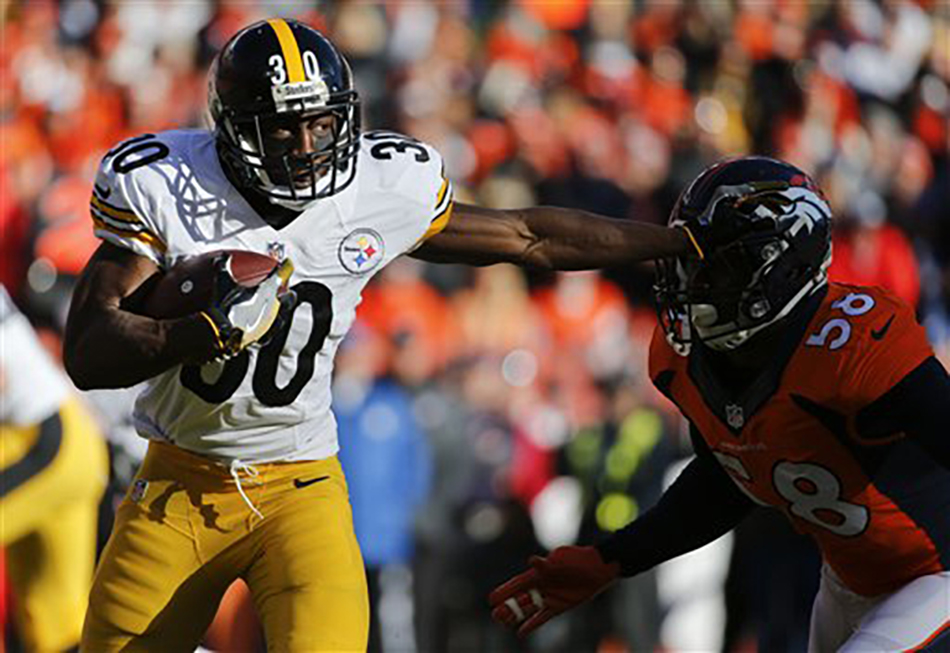 Pittsburgh Steelers running back Jordan Todman , left, pushes off Denver Broncos outside linebacker Von Miller during the first half in an NFL football divisional playoff game, Sunday, Jan. 17, 2016, in Denver. (AP Photo/Jack Dempsey)