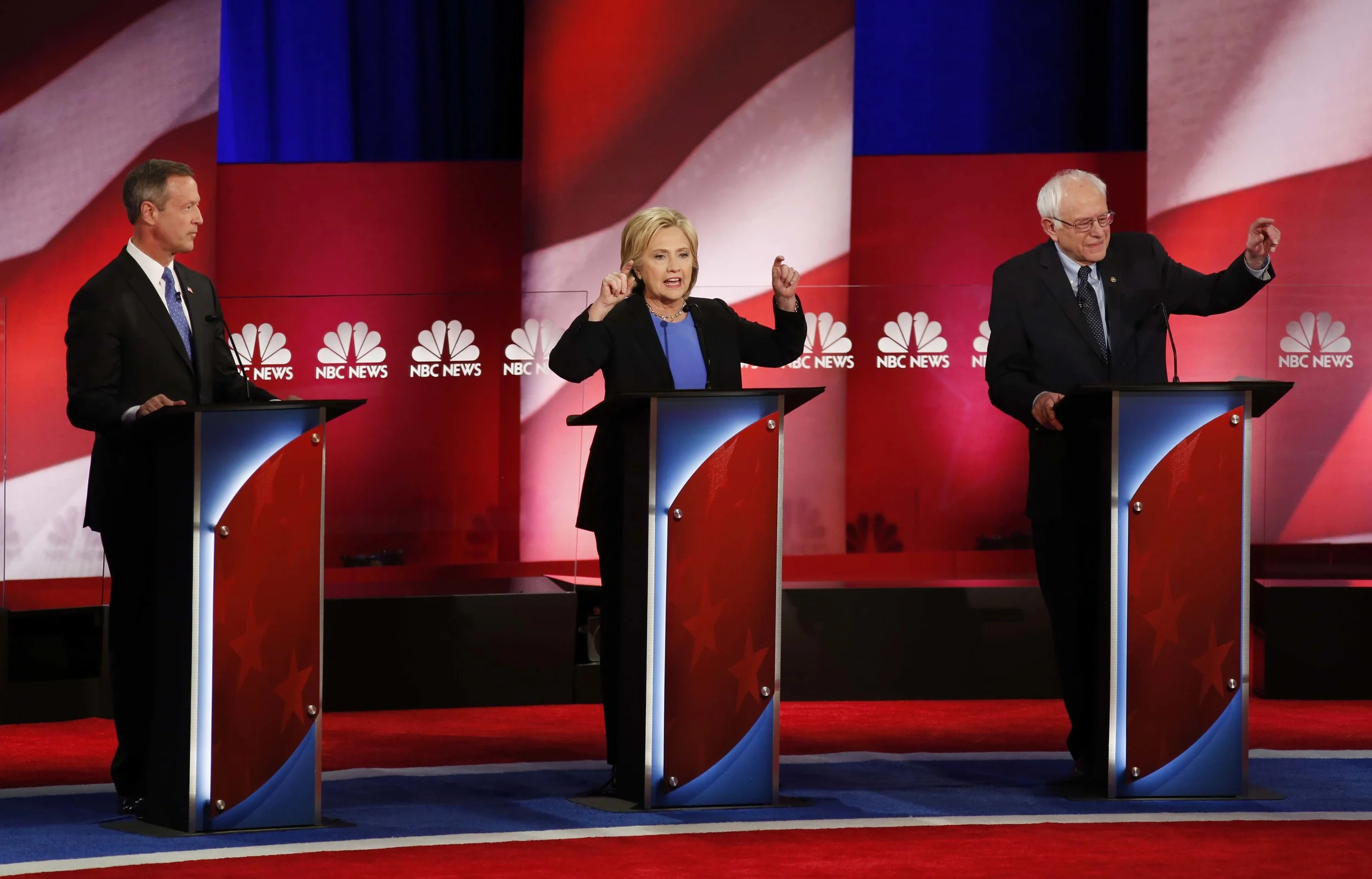 Democratic presidential candidate, former Maryland Gov. Martin O'Malley , left, listens to Democratic presidential candidates, Hillary Clinton and Sen. Bernie Sanders, I-Vt, speak, during the the NBC, YouTube Democraticpresidential debate at the Gaillard Center, Sunday, Jan. 17, 2016, in Charleston, S.C. (AP)