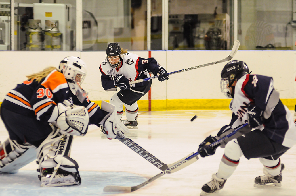 UConn women's ice hockey sophomore forward Theresa Knutson (middle) skates toward the net during the Huskies' game against Syracuse at the Freitas Ice Forum in Storrs, Connecticut on Saturday, Oct. 17, 2015. (Jason Jiang/The Daily Campus)