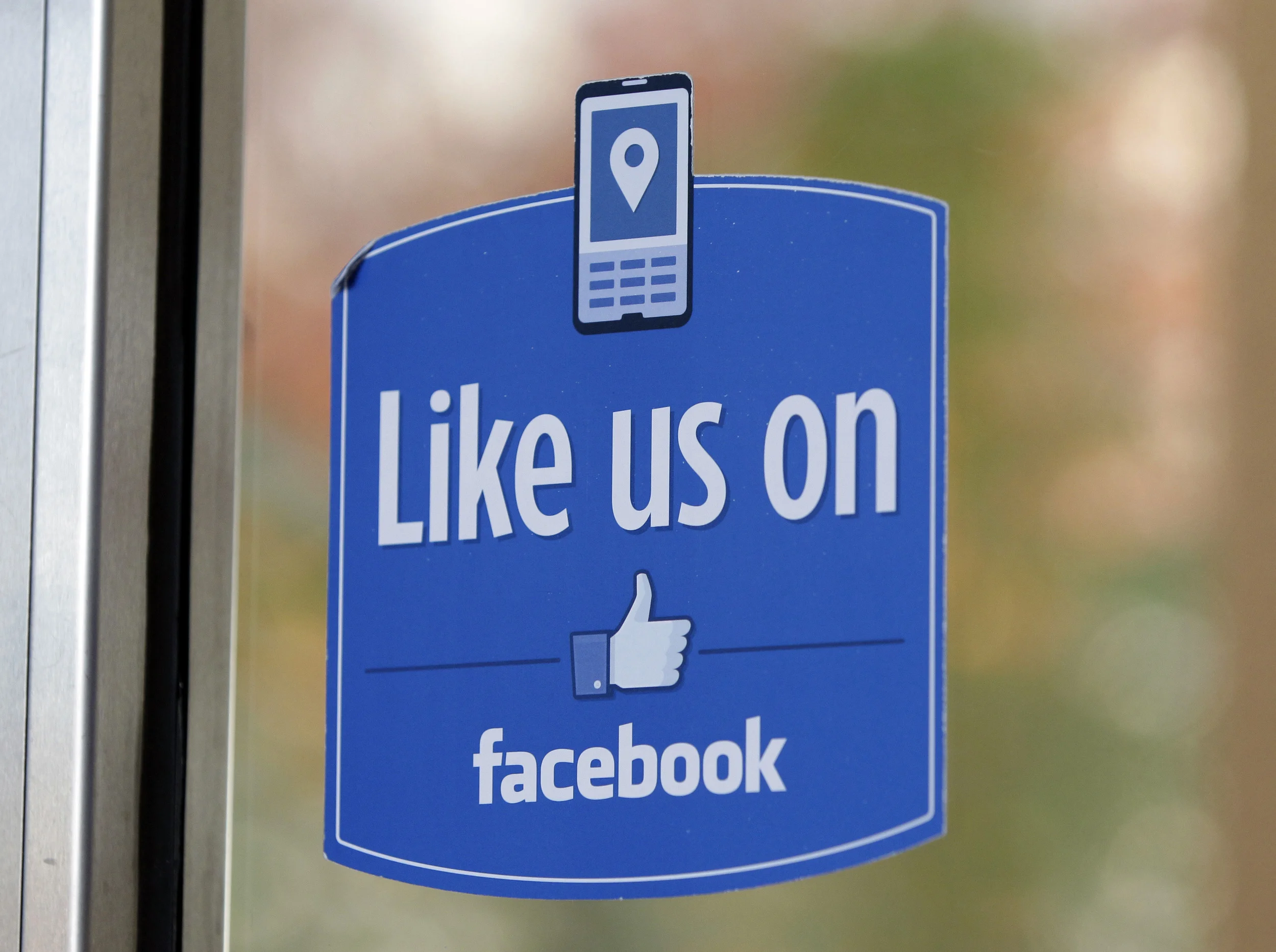 In this Dec. 13, 2011 file photo, a sign with Facebook's "Like" logo is posted at Facebook headquarters near the office for the company's User Operations Safety Team in Menlo Park, Calif. After four months of testing outside the U.S., Facebook CEO Mark Zuckerberg said on Wednesday, Jan. 27, 2016, that "pretty soon" multiple new emotions will be added to the social network throughout the world. (Paul Sakuma, File/AP)