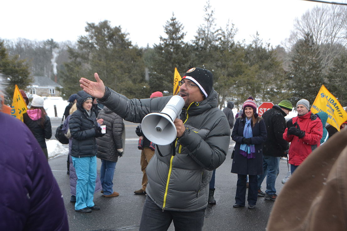 Hospital employees are seen protesting outside of Natchaug Hospital in Mansfield, Connecticut on Monday, Feb. 15, 2016. Roughly 40 hospital employees lined up in frigid conditions with signs reading, “be fair to those who care,” hanging from their necks to protest the hospital’s proposed plan to drop employee pensions in favor of a 401K plan. (Bailey Wright/The Daily Campus)