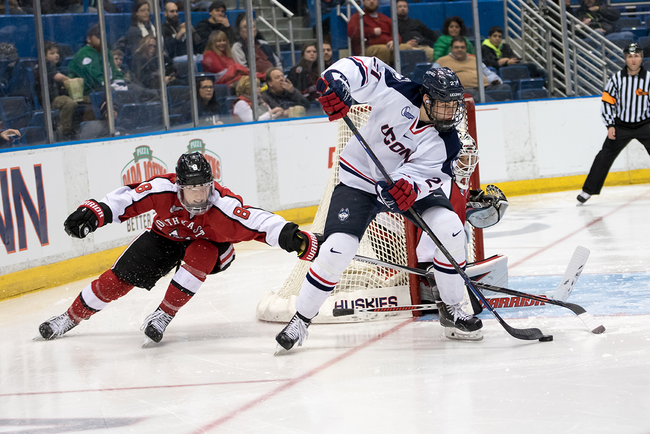 UConn men's ice hockey forward Maxim Letunov handles the puck in front of the Northeastern net during the Huskies' game at the XL Center in Storrs, Connecticut on Friday, Feb. 19, 2016. (Tyler Benton/The Daily Campus)