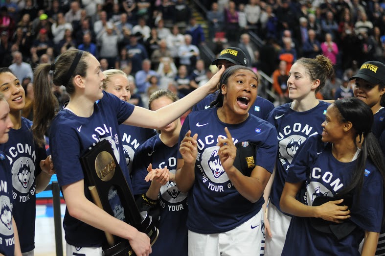 From left to right: Breanna Stewart, Morgan Tuck and Moriah Jefferson goof around following their 86-65 victory over No. 2 seed Texas in the Elite Eight on Monday, March 28 at Webster Bank Arena in Bridgeport, Connecticut. Tuck scored a team high 22 points, while Stewart had 21 and Jefferson had 11. It is the trio's last NCAA tournament in a Huskies uniform. (Bailey Wright/The Daily Campus)
