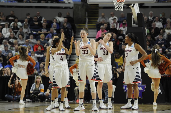 From left to right: Moriah Jefferson, Katie Lou Samuelson, Brianna Stewart and Morgan Tuck rest during a timeout on Monday, March 28 at the Webster Bank Arena in Bridgeport, Connecticut. Samuelson recorded nine points with six rebounds en route to an 86-65 victory over Texas. (Bailey Wright/The Daily Campus)