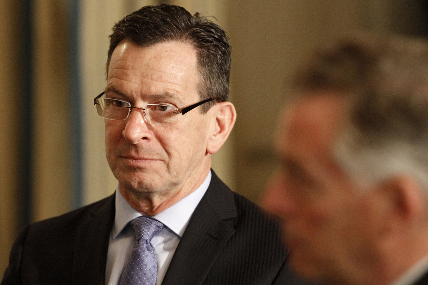 Connecticut Gov. Dannel Malloy, left, next to National Governors Association Winter Meeting Vice Chair, Virginia Gov. Terry McAuliffe, listens to President Barack Obama speak during a meeting with governors in the State Dining Room of the White House in Washington, Monday, Feb. 22, 2016. (AP Photo/Jacquelyn Martin)