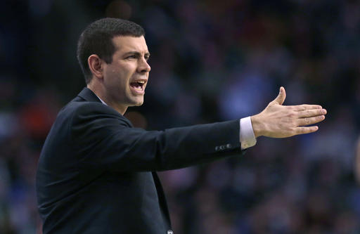 Boston Celtics head coach Brad Stevens calls to his players during the first quarter of an NBA basketball game against the Toronto Raptors in Boston, Wednesday, March 23, 2016. (AP Photo/Charles Krupa)