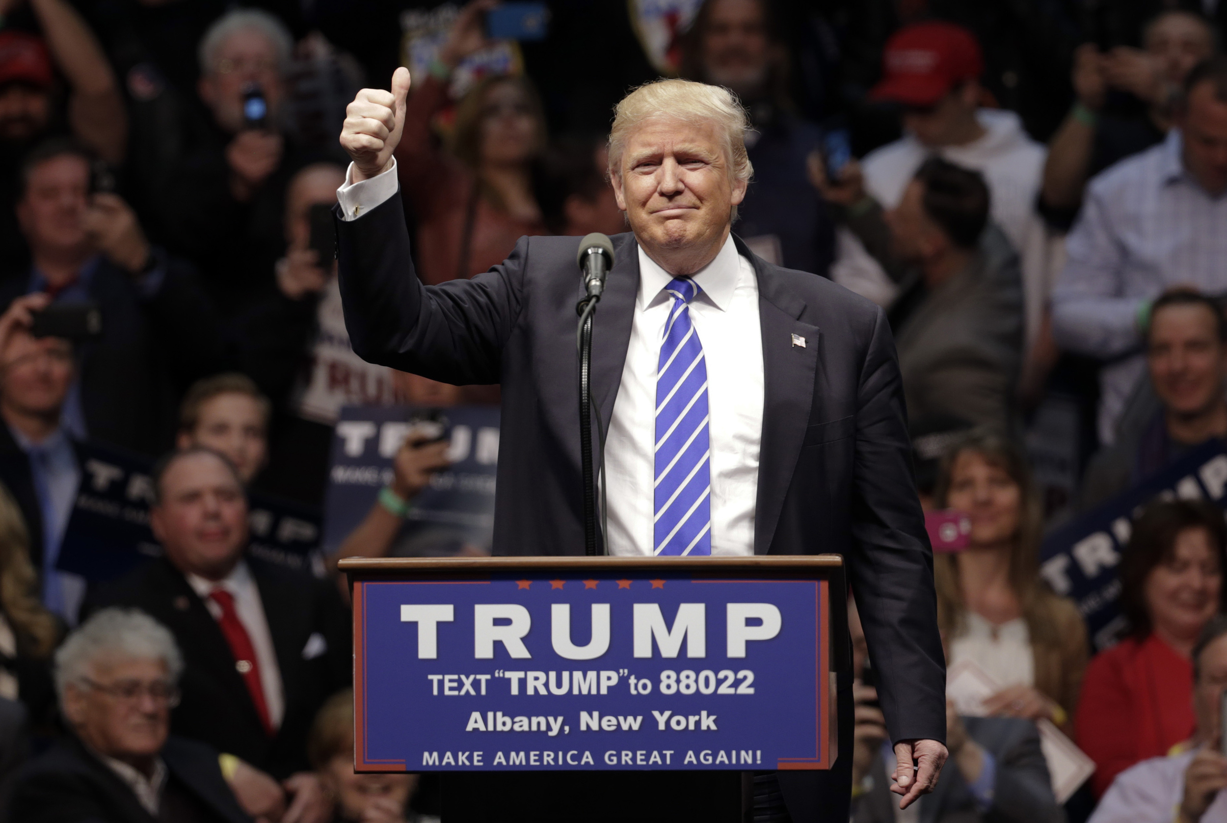 Republican presidential candidate Donald Trump acknowledges the crown during a rally at the Times Union Center on Monday, April 11, 2016, in Albany, N.Y. (AP Photo/Mike Groll)