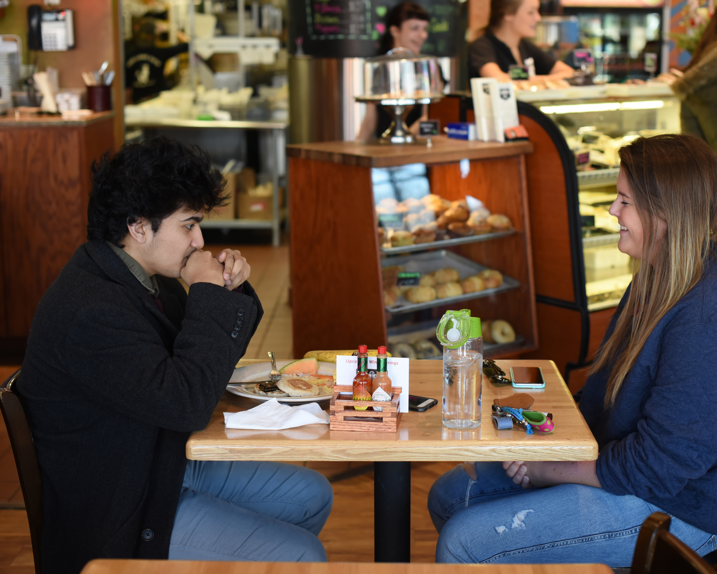 Dani Kosinski, a long-time sports fan, pictured with Associate Life Editor Anokh Palakurthi, jokes her ideal date would include a trip to a Giants or Yankees game. (Zhelun Lang/Daily Campus)