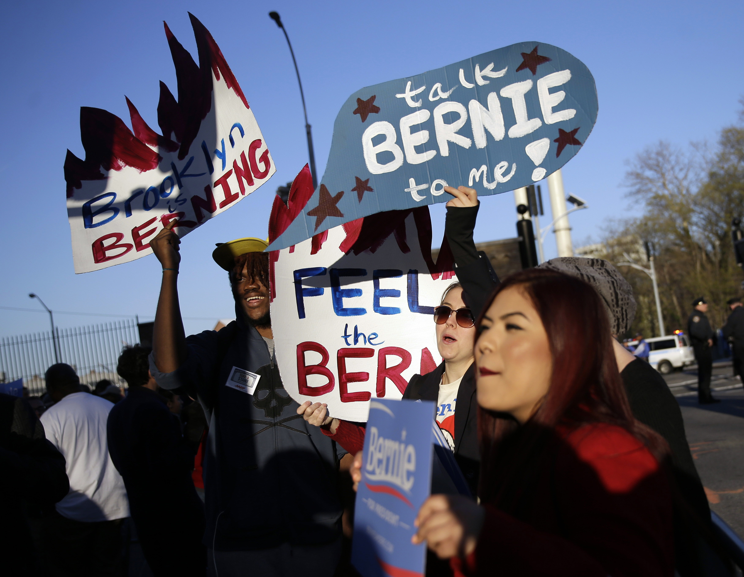 Supporters of Democratic presidential candidate Sen. Bernie Sanders, I-Vt, gather outside the Brooklyn Navy Yard before Sanders faces Hillary Clinton in the CNN Democratic Presidential Primary Debate on Thursday, April 14, 2016 in New York. (AP Photo/Seth Wenig)