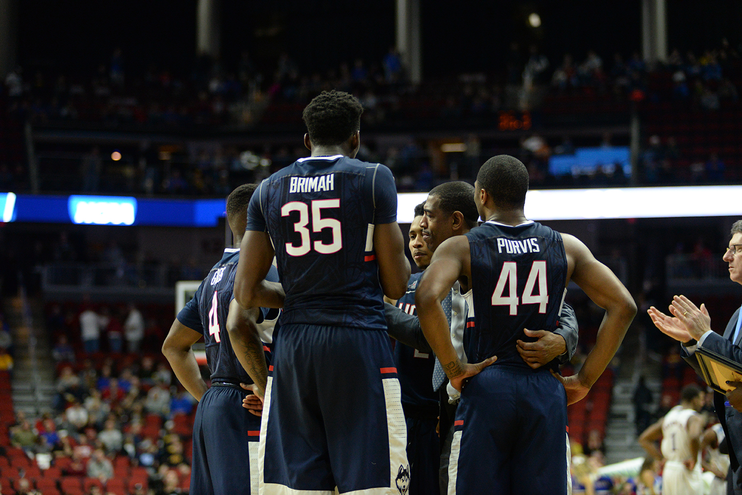 Amida Brimah and Rodney Purvis huddle with their teammates during UConn's 73-61 loss to Kansas in the 2nd round of the NCAA Tournament on March 19, 2016. Brimah and Purvis announced Tuesday that they were withdrawing their names from consideration in the NBA Draft. (File photo/The Daily Campus)