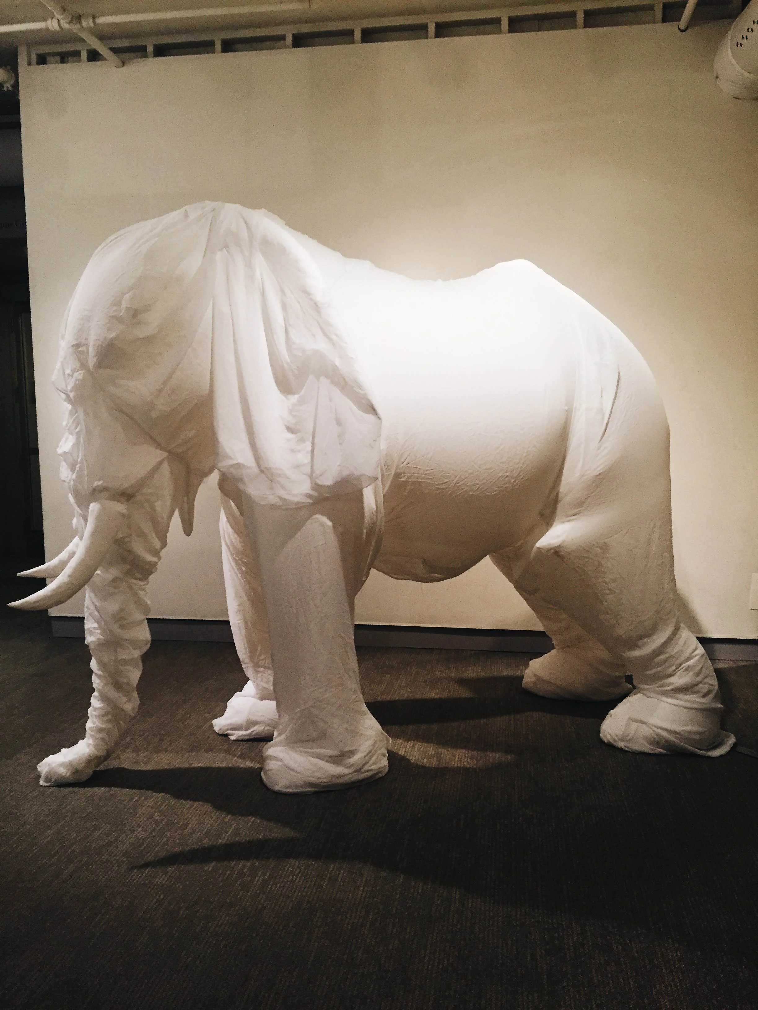 A 10-feet-tall piece titled “White Elephant I” by Billie Grace Lynn. It is composed of rip stop nylon, chiffon and an electric fan. (Megan Krementowski/The Daily Campus)