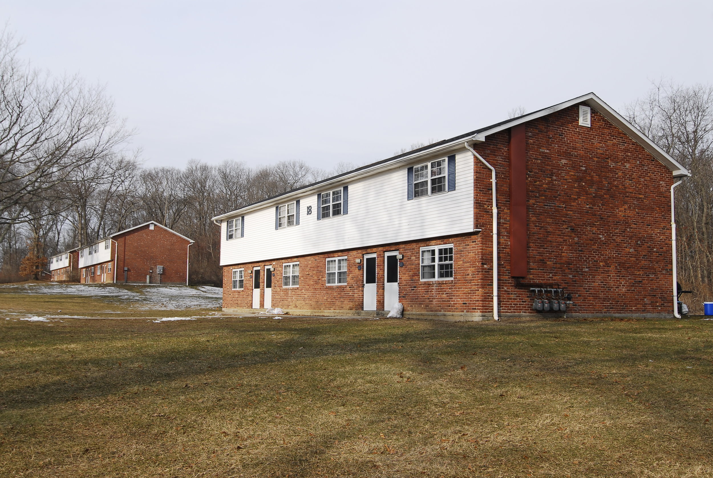 The exit of Carriage Townhouse Apartments, located on Hunting Lodge Road, was surrounded by firetrucks and first responders after a fire broke out on Tuesday, Aug. 31, 2016. This file photo shows the townhouses during winter. (File Photo/The Daily Campus)