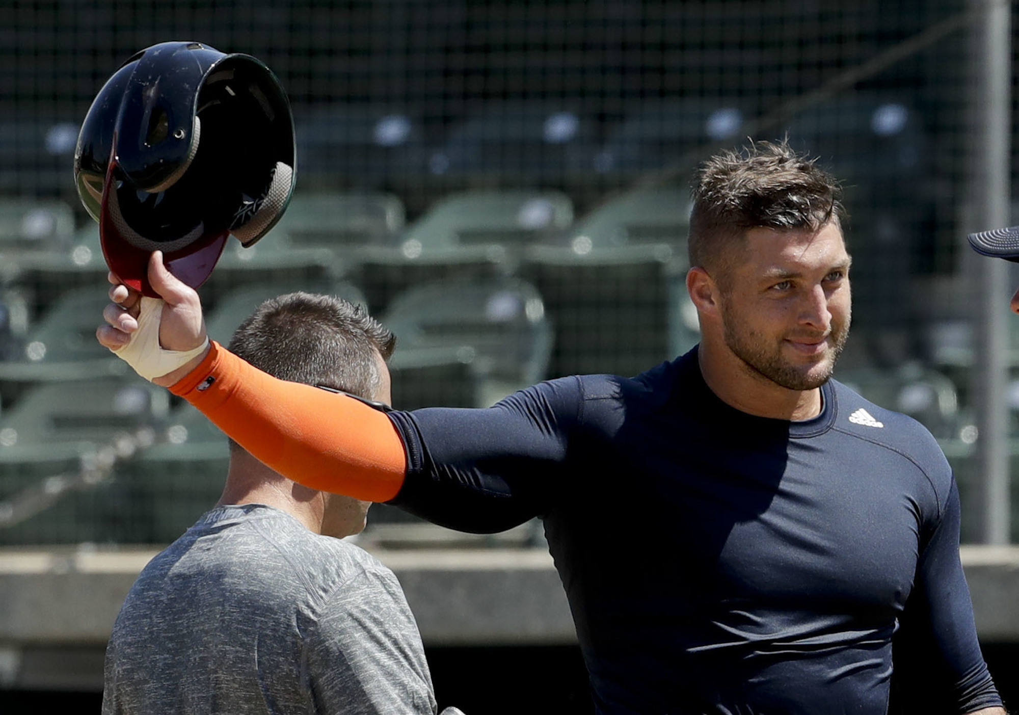 In this Aug. 30, 2016, file photo, former NFL quarterback Tim Tebow finishes his work out for baseball scouts and the media in Los Angeles. Tebow has signed a minor league contract with the New York Mets. (Chris Carlson/AP)