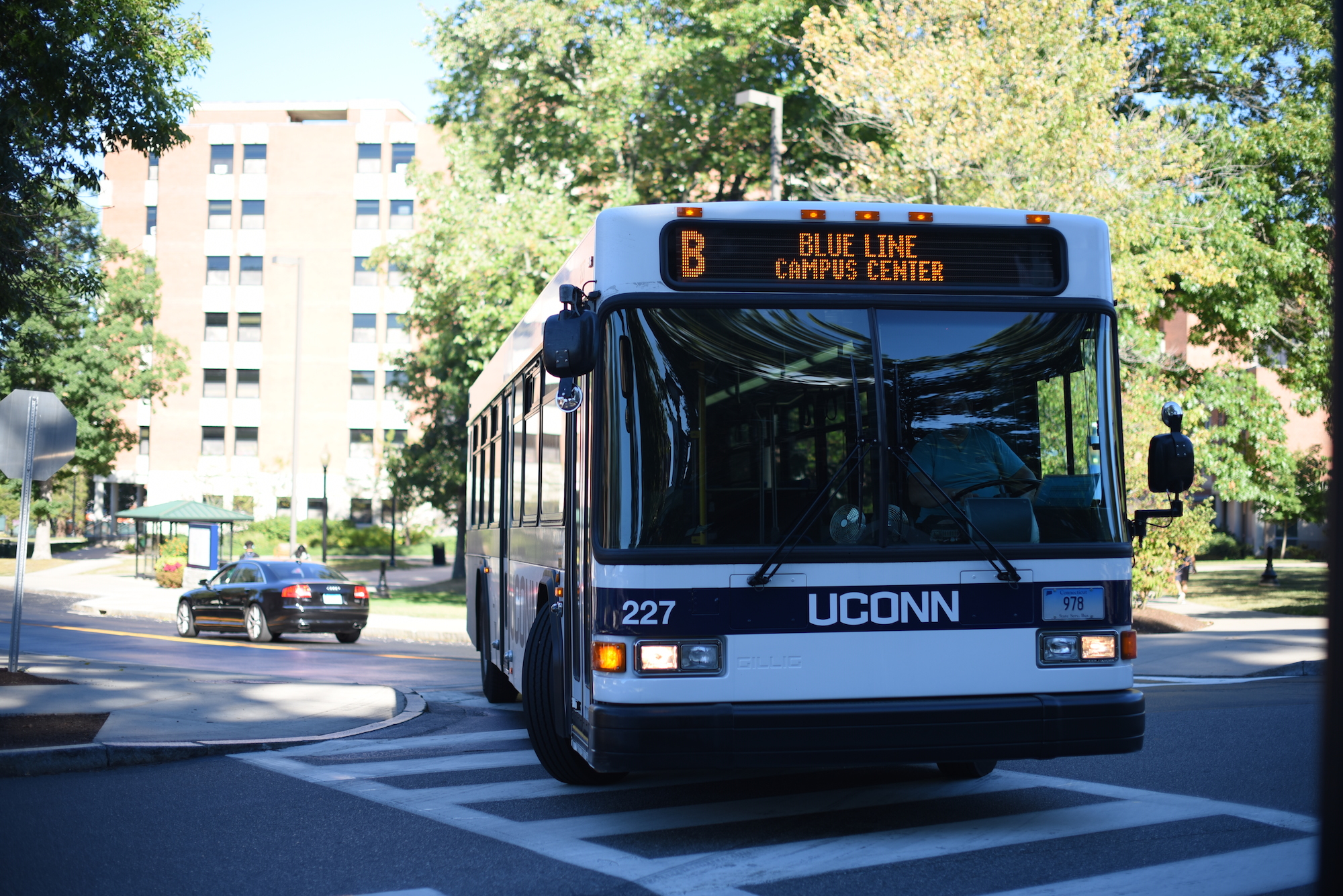 A UConn Transportation Services bus passes through the center of campus. (Zhelun Lang/The Daily Campus)